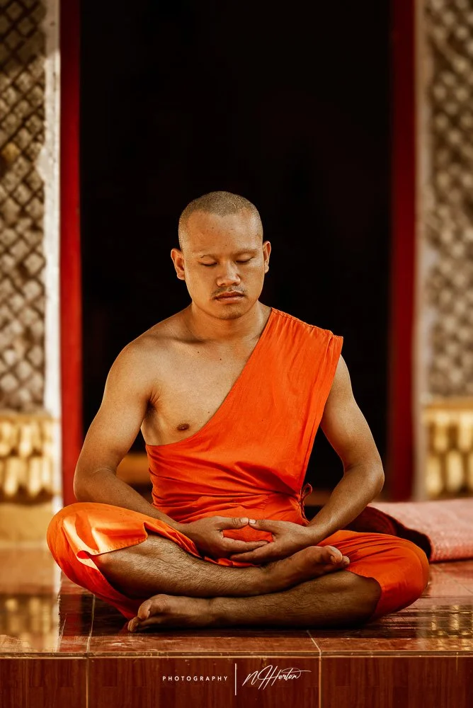 Portrait of monk meditating in Laos