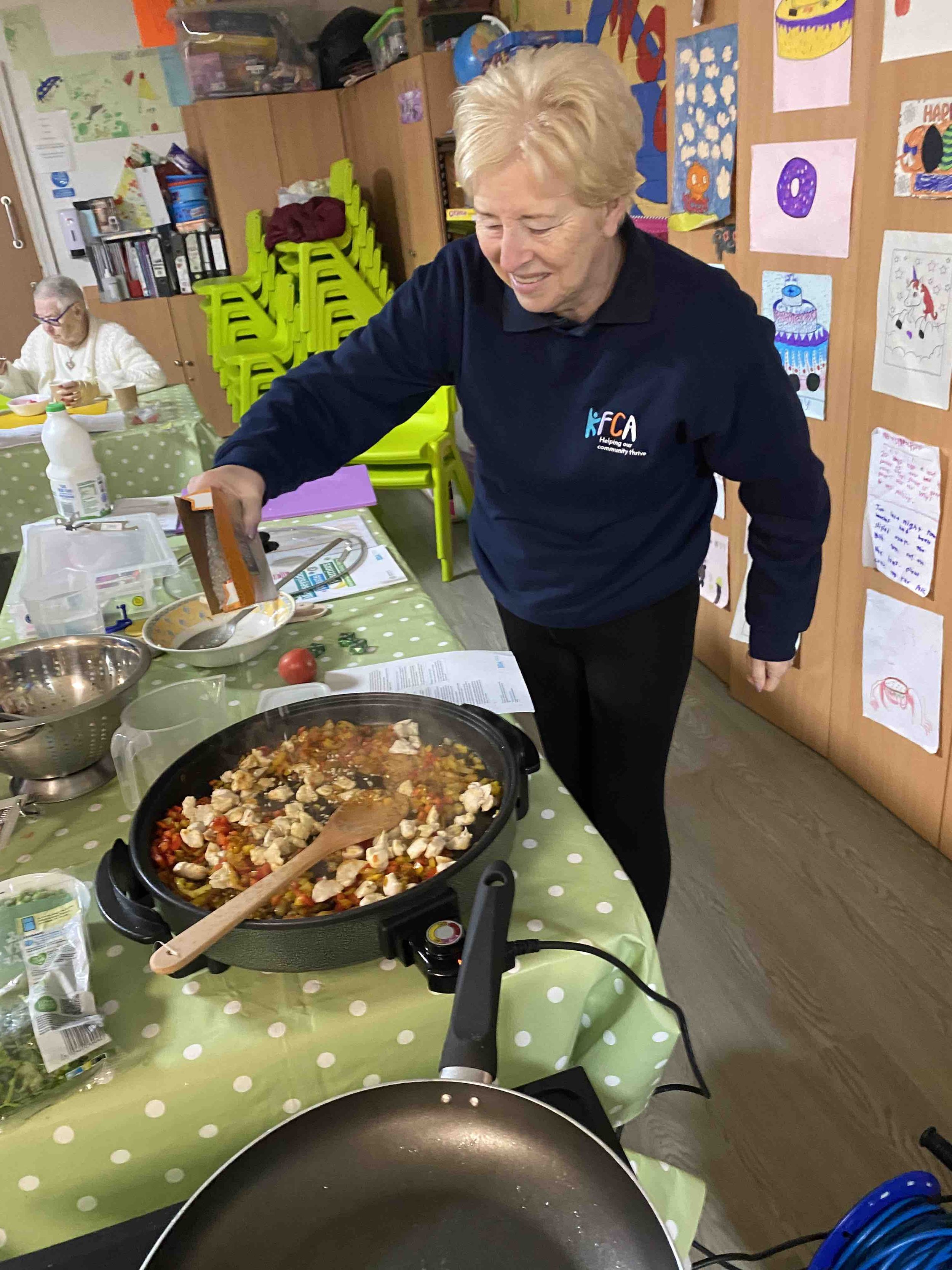 Sue making paella.jpg