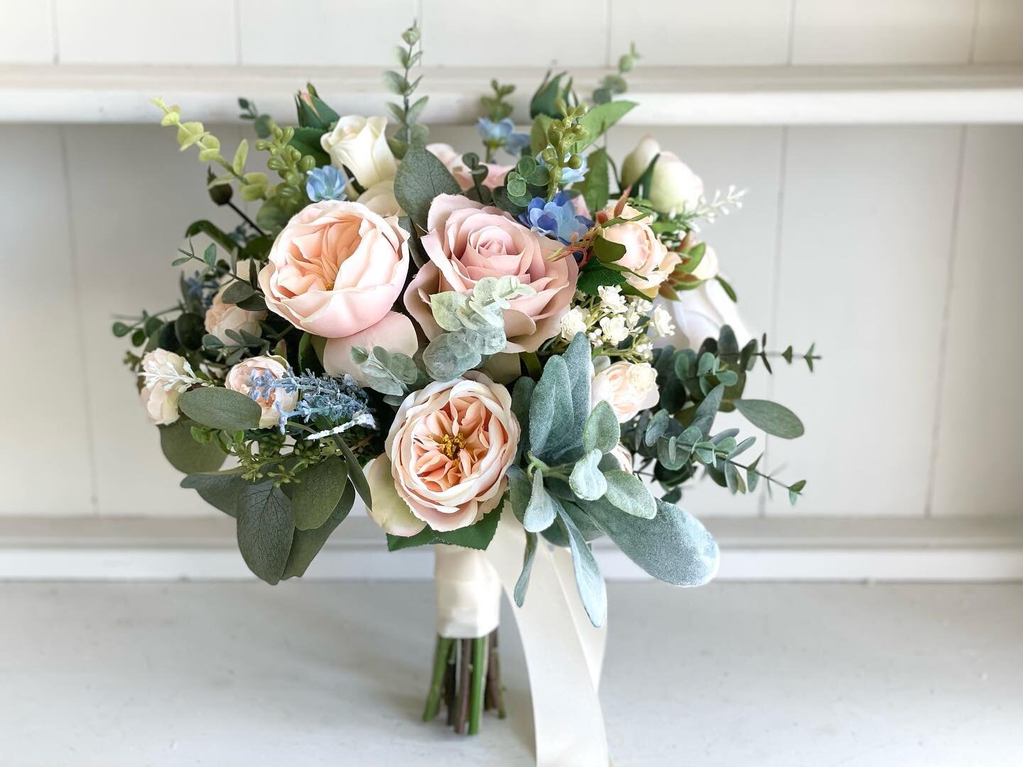 Pretty blush, peach and pale blue custom wedding flowers #weddingbouquet #weddingflowers #flowerarrangement