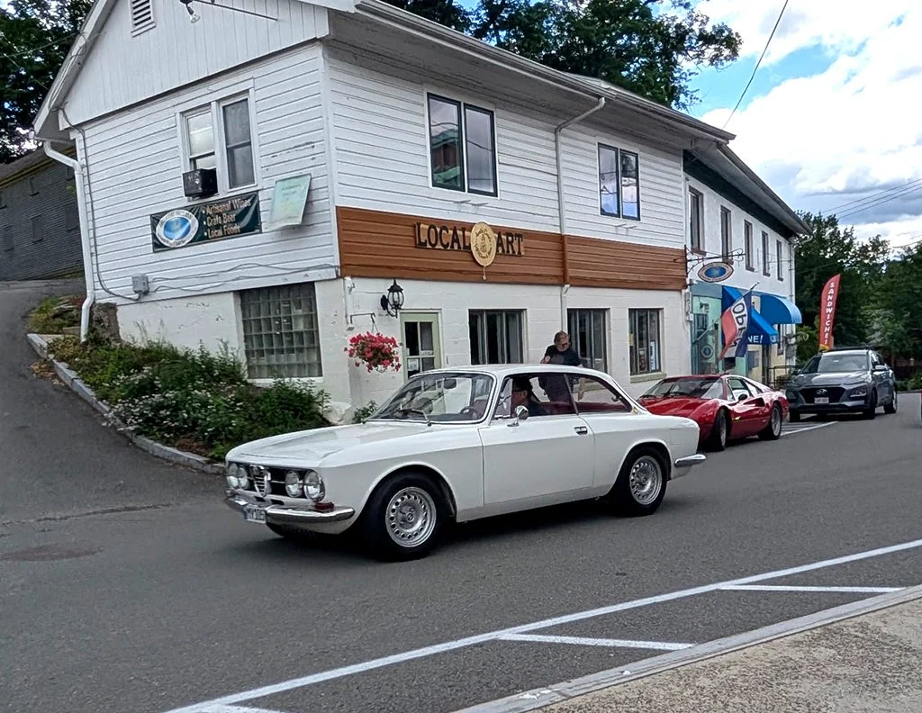 Our cars, in sequence, starting out on our tour