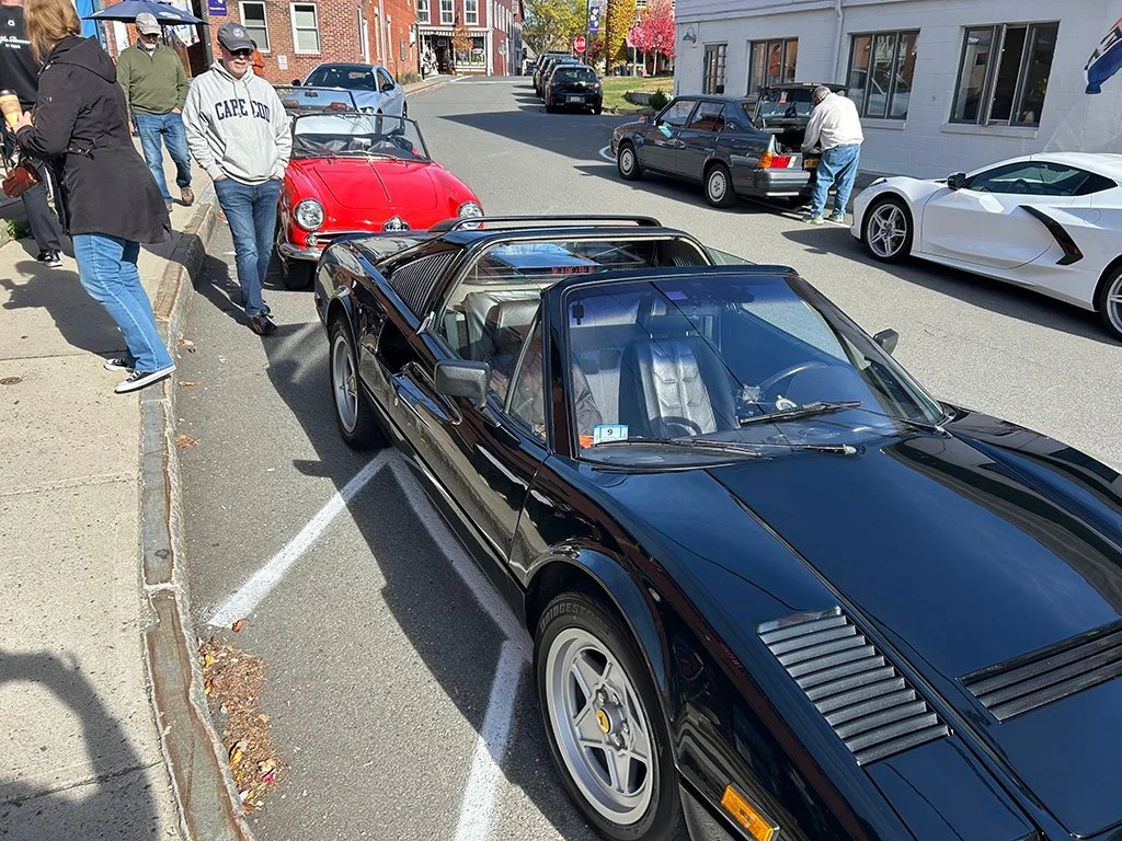 Admiring one of the lesser cars
