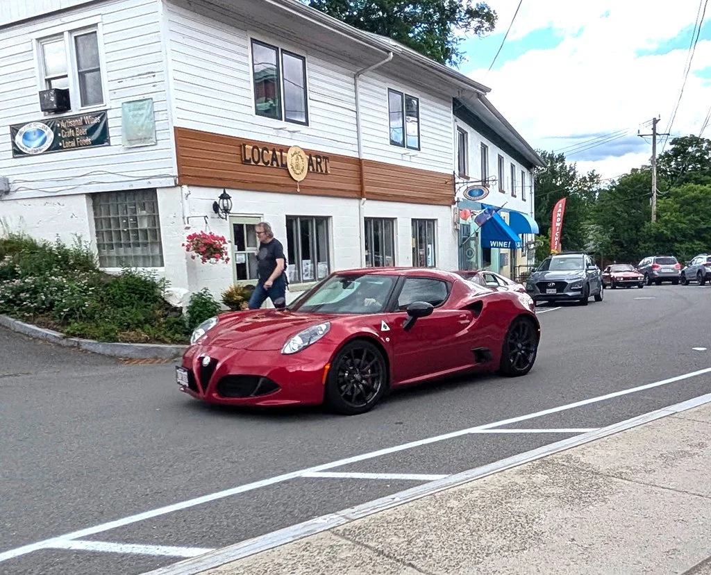 Our cars, in sequence, starting out on our tour
