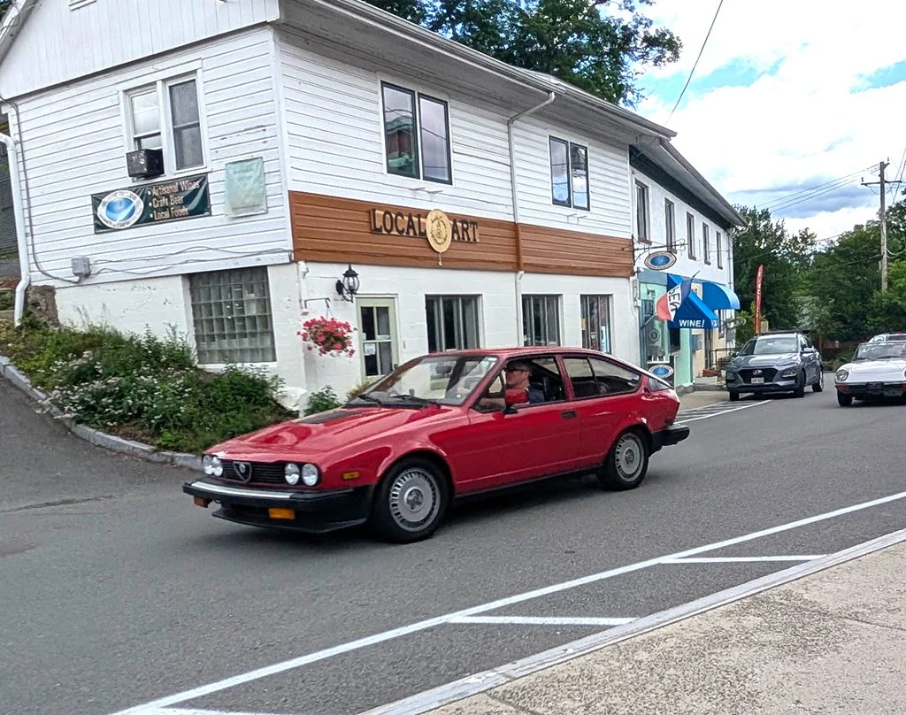 Our cars, in sequence, starting out on our tour
