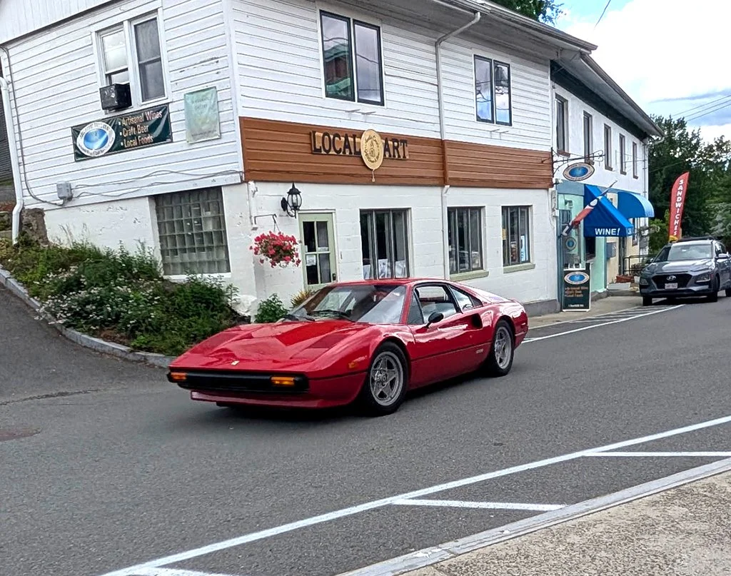 Our cars, in sequence, starting out on our tour