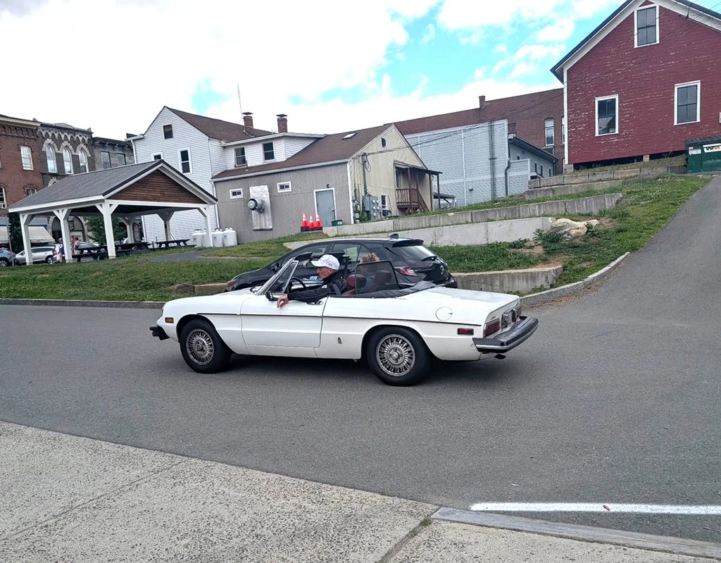 Our cars, in sequence, starting out on our tour
