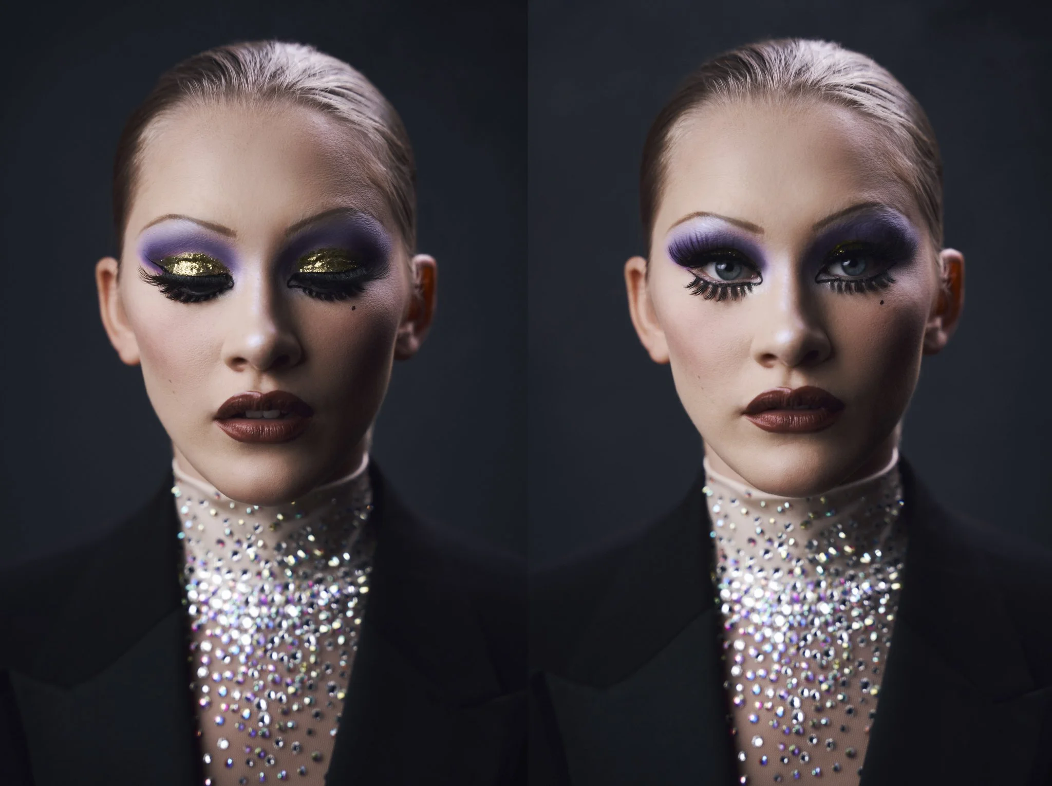 Close-up of a woman with glamorous makeup. She has purple and gold eyeshadow, black eyeliner, and long eyelashes. She is wearing a high-neck top decorated with multicolored rhinestones. Her hair is slicked back, and she has a serious expression with 