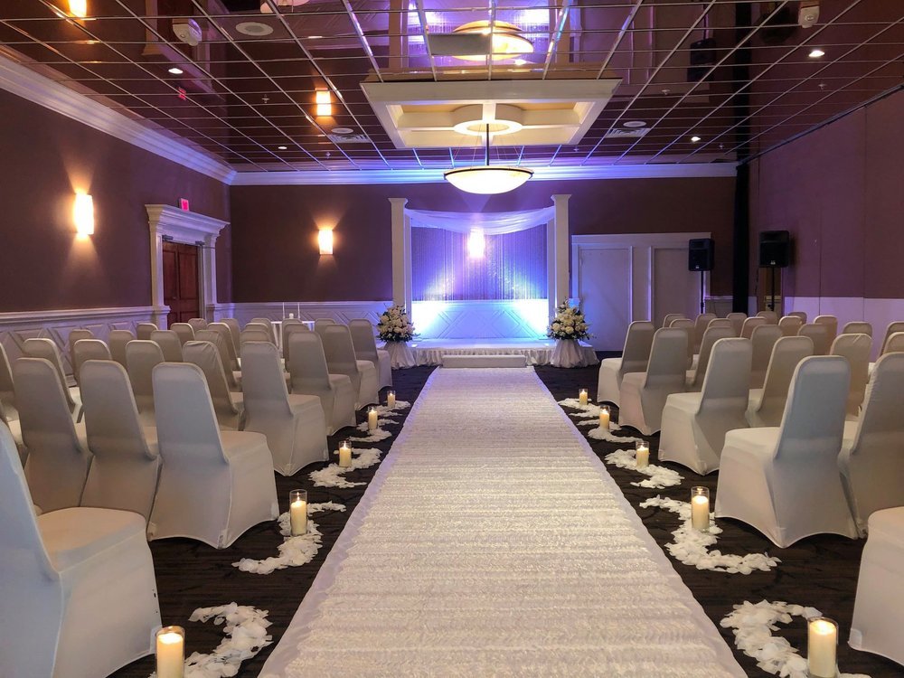 Ceremony+Arch+with+Platform,+Crystal+Backdrop,+and+Florals.jpg
