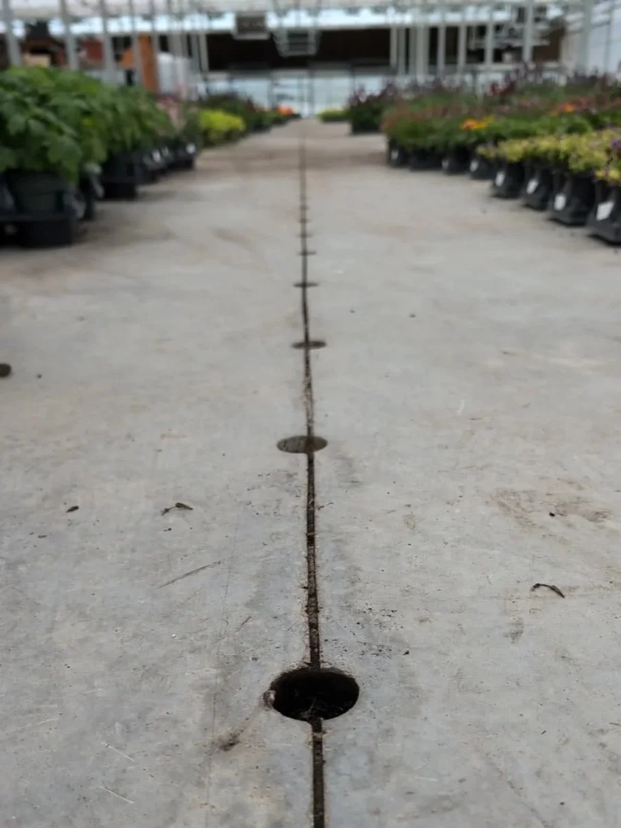 Image of drainage holes drilled into concrete