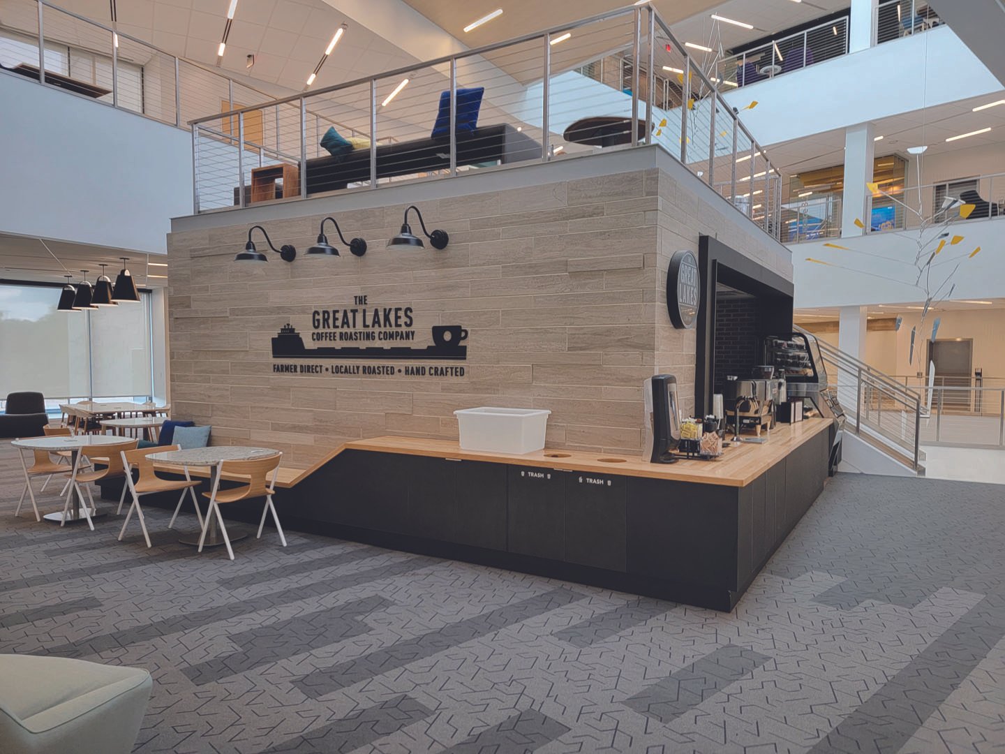 Final installation photo of the Great Lakes Coffee mug ship dimensional sign.
