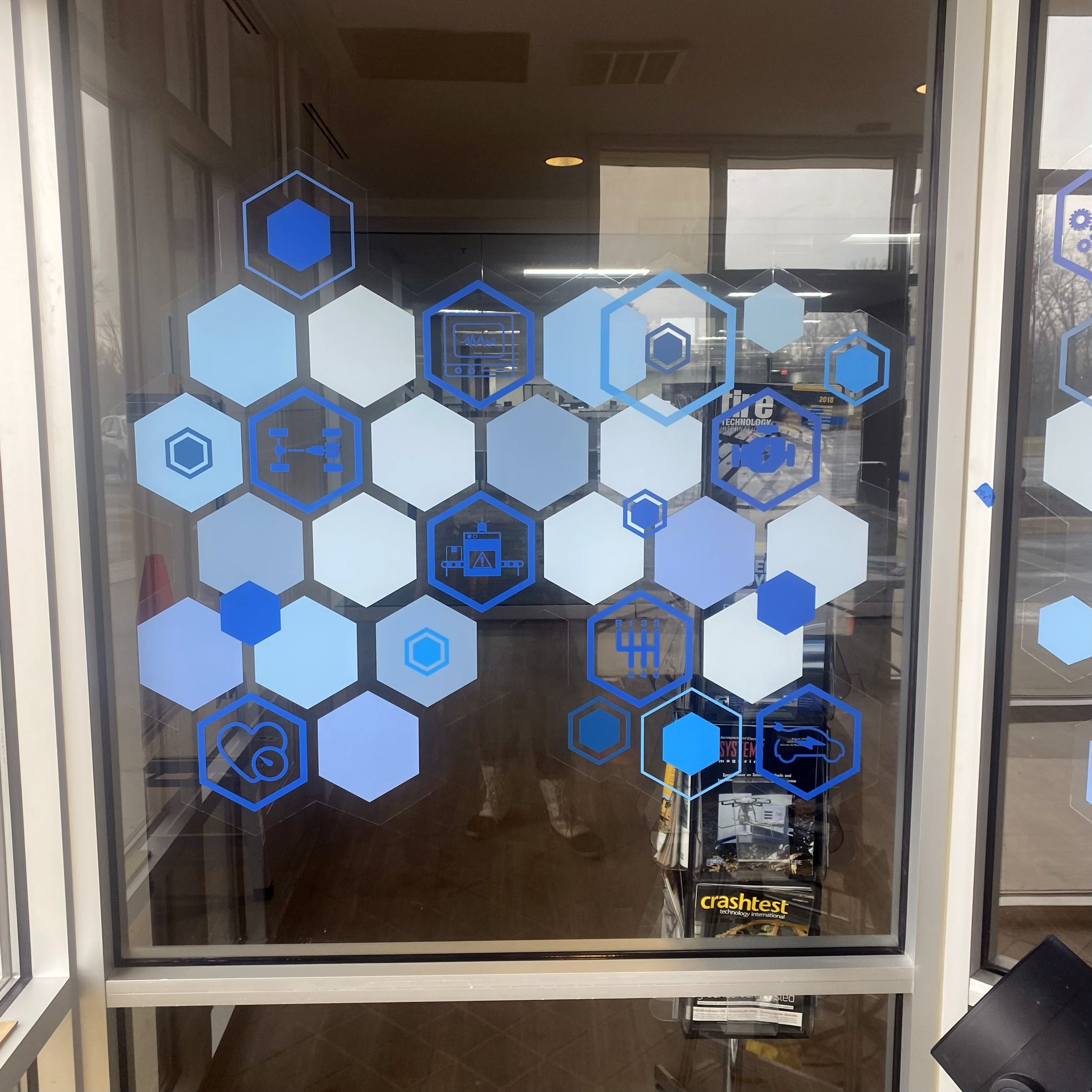 Close-up view of the final lobby glass graphics after install.