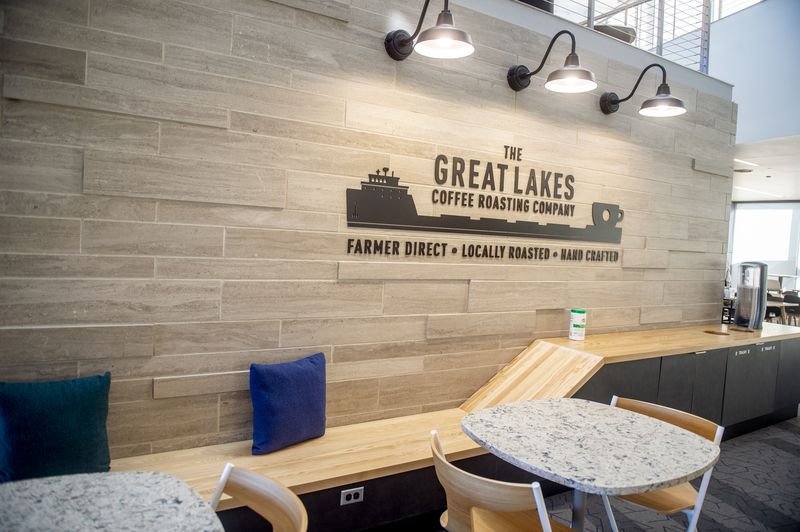 Final installation photo of the Great Lakes Coffee mug ship dimensional sign.