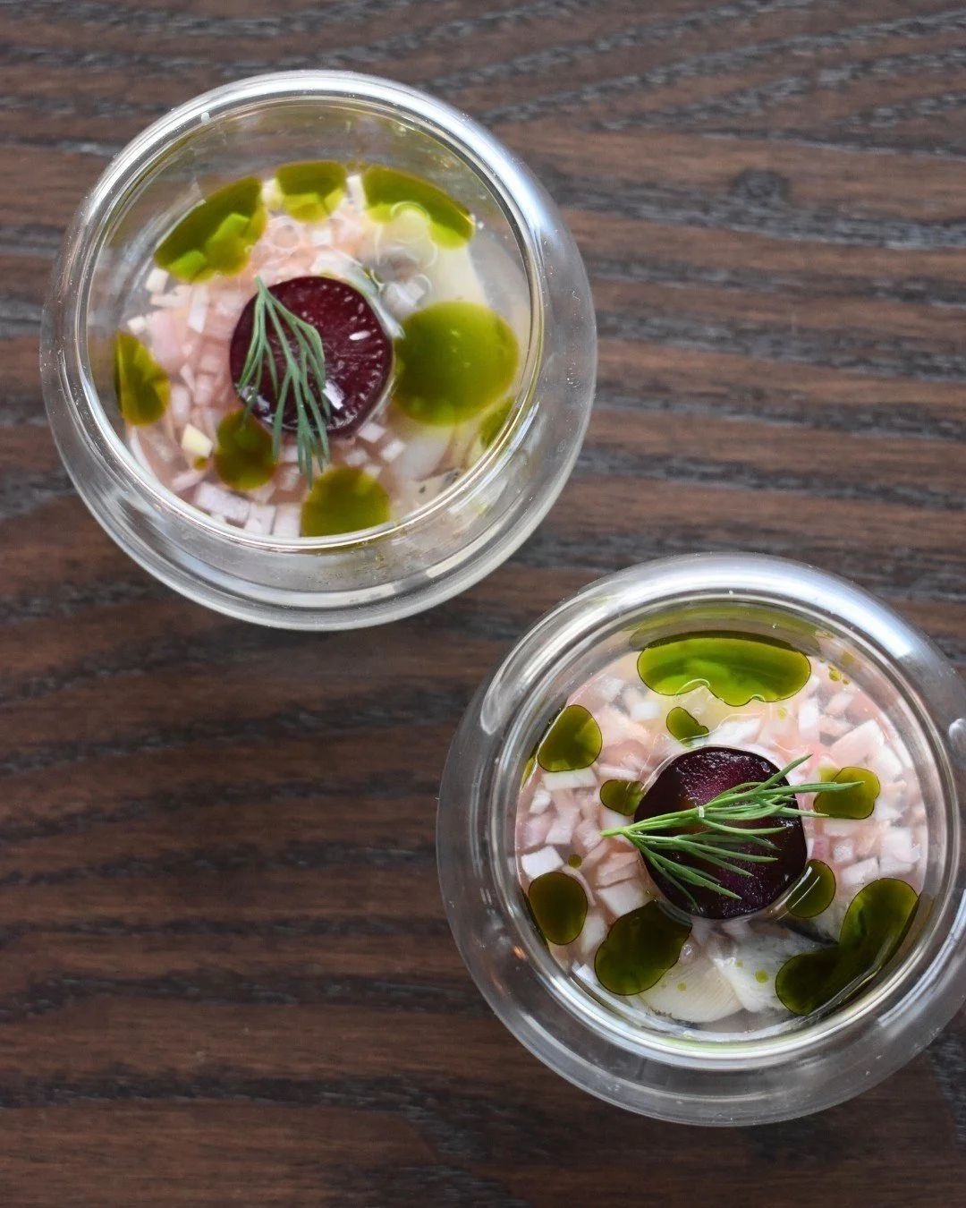 Oyster shooters: our specialty, your pleasure. 🦪Verjus mignonette, pickled grape, and dill oil.