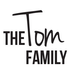 Logo with the text 'The TDM Family' in stylized black font.