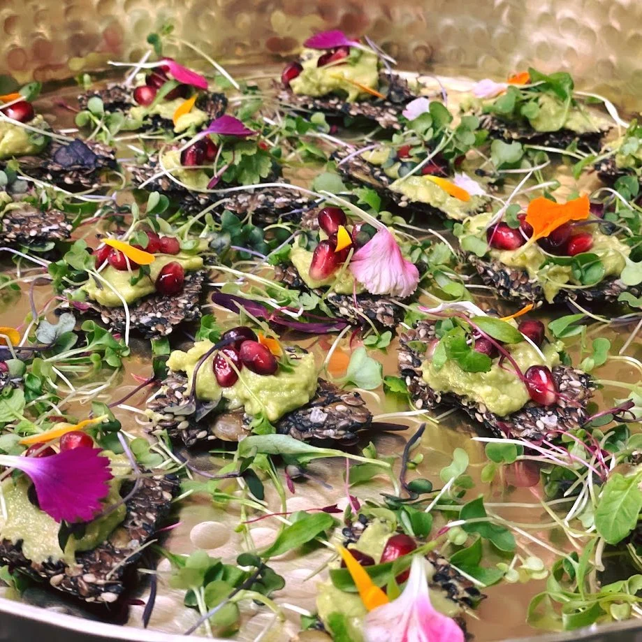 Many of our spring dishes are naturally gluten-free &mdash; like these house-made seed crackers topped with avocado mash, pomegranate, microgreens, and edible flowers.

Fresh, seasonal, and inclusive without sacrificing flavor.

Planning a spring eve