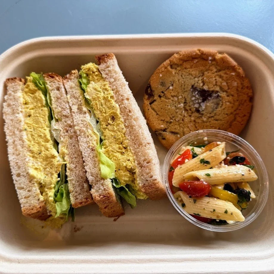 Why hello, old friend! Our Curried Chicken Salad Sandwich is back on the box lunch menu for spring!  Featuring slow roasted chicken, celery, dried apricot, yogurt, mayo, curry, scallion, and lettuce on multigrain bread. Includes a fresh side and a fr