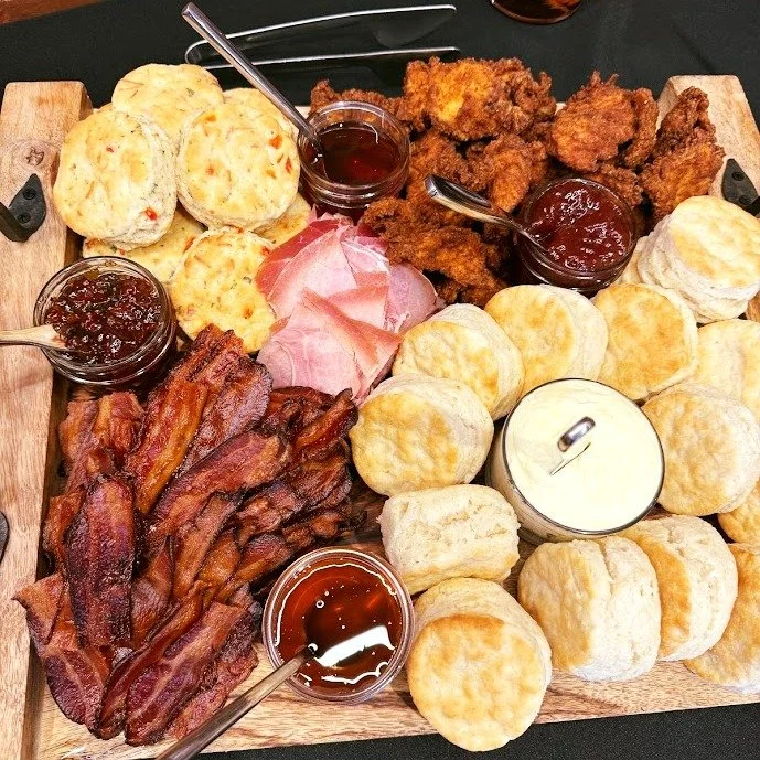 Build-your-own biscuit bar, done right.

Flaky buttermilk biscuits, pimento cheese biscuits, crispy fried chicken, applewood smoked bacon, and Kentucky country ham&mdash;paired with strawberry jam, pepper jelly, local honey, hot honey, and whipped bu