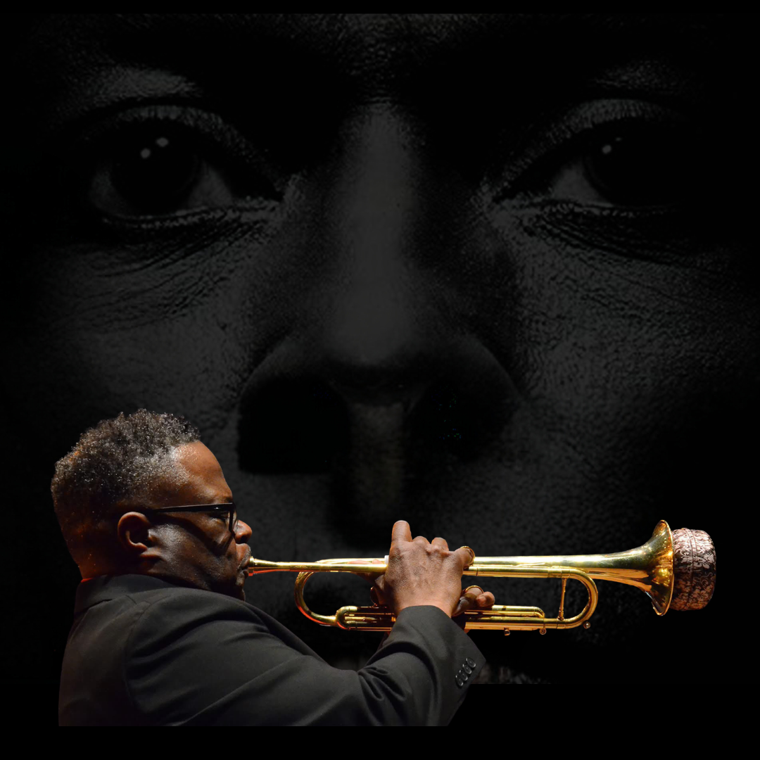 Profile of Orbert Davis playing a brass trumpet against a shadowy background displaying a close-up of eyes.