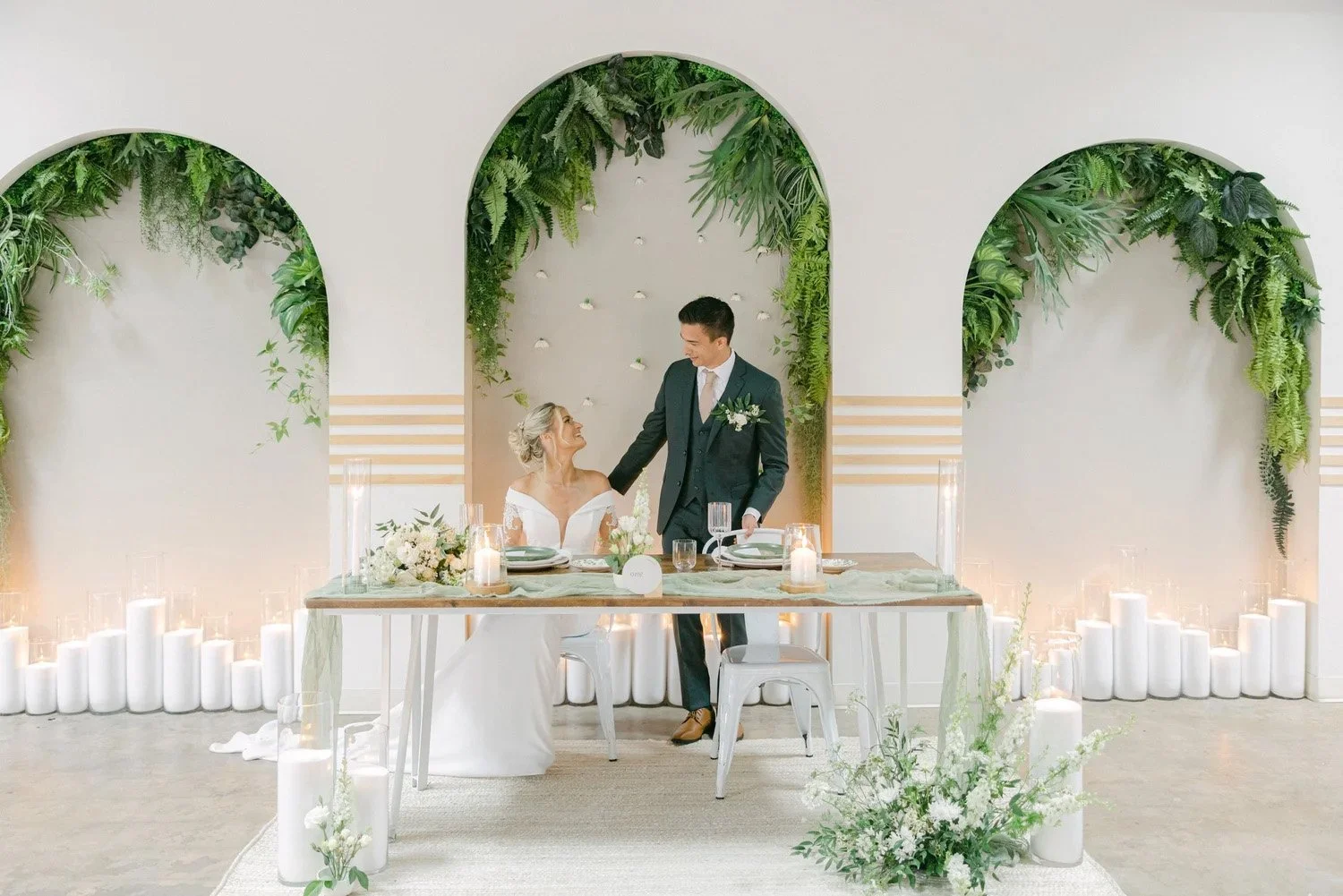 Newly wed couple at their dining table at the Vistonian wedding venue in Vista California
