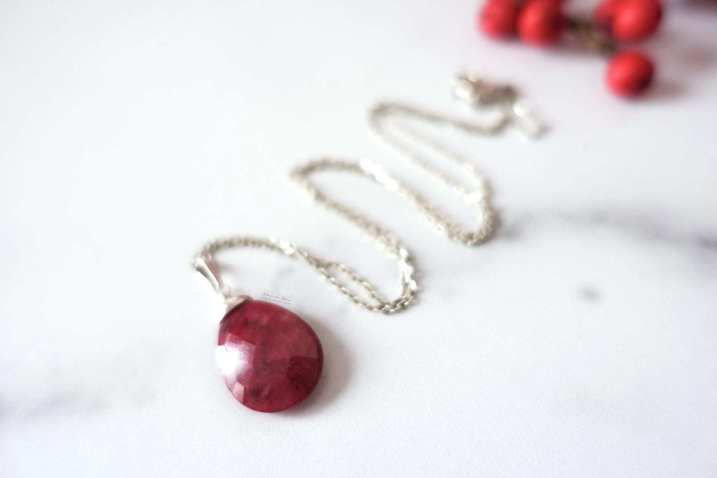 ruby ss necklace holiday out of focus soft blur.jpg