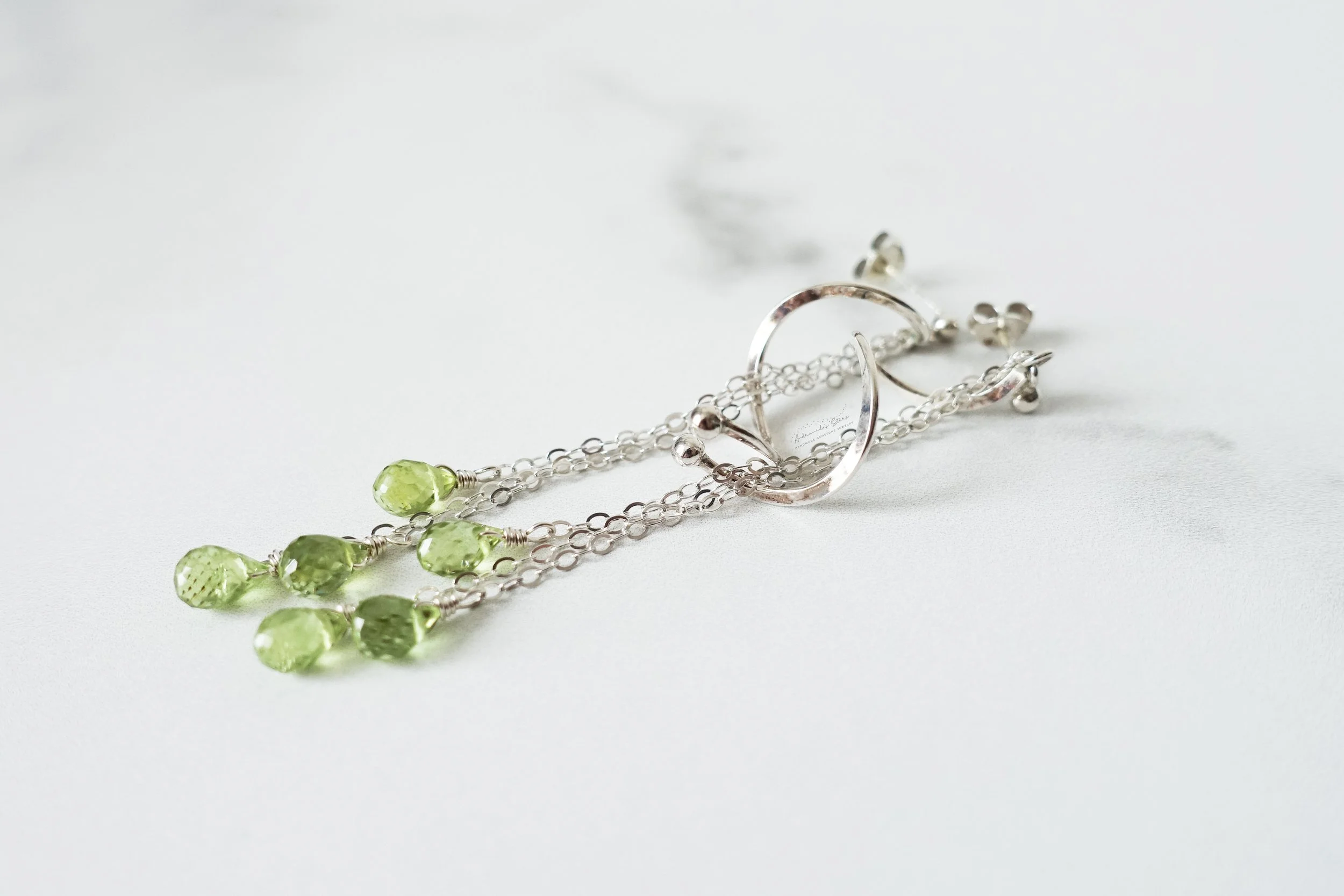 peridot spiral dangle earrings close up ss.jpg