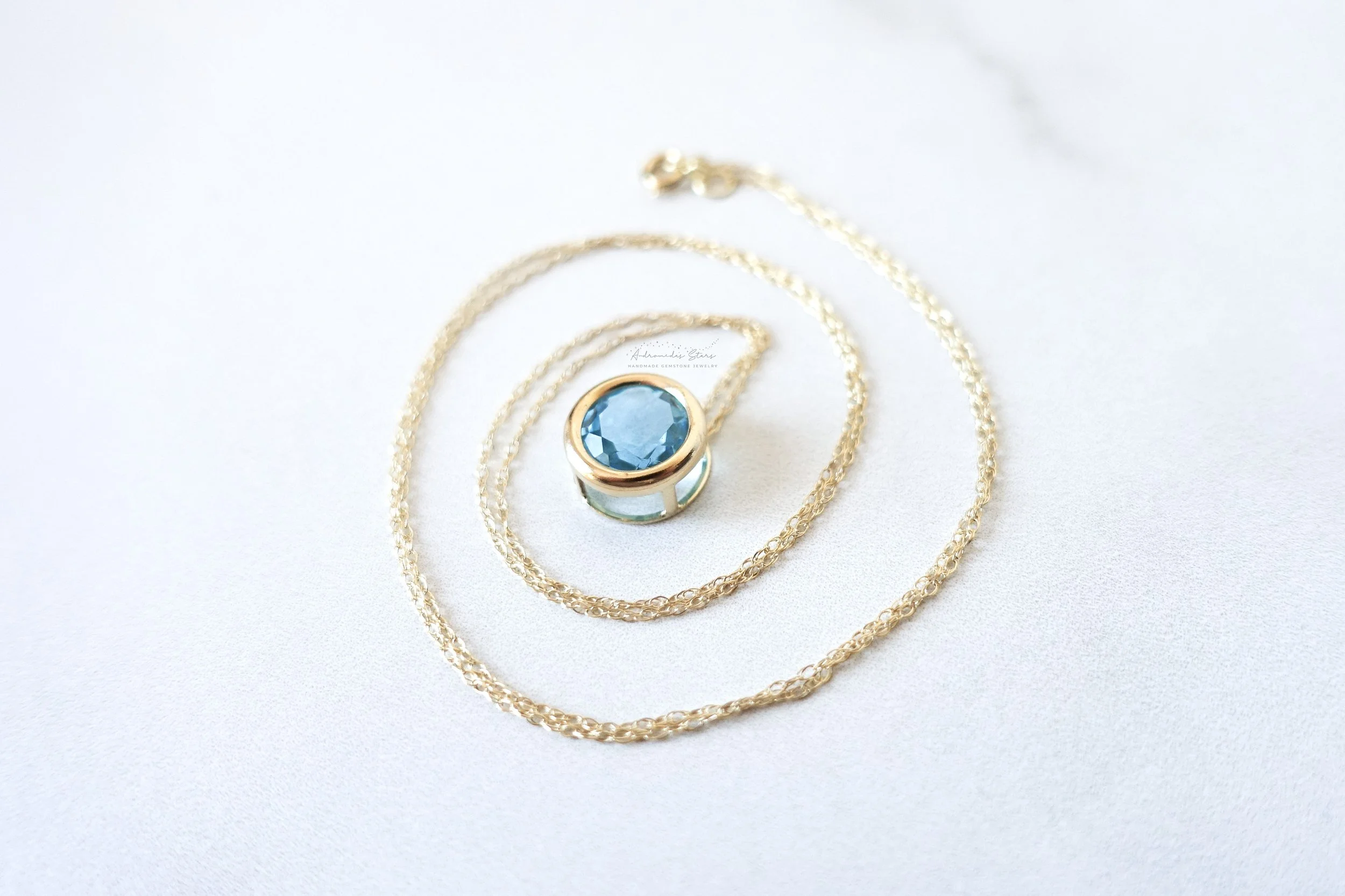 blue topaz necklace 14k swirl.jpg