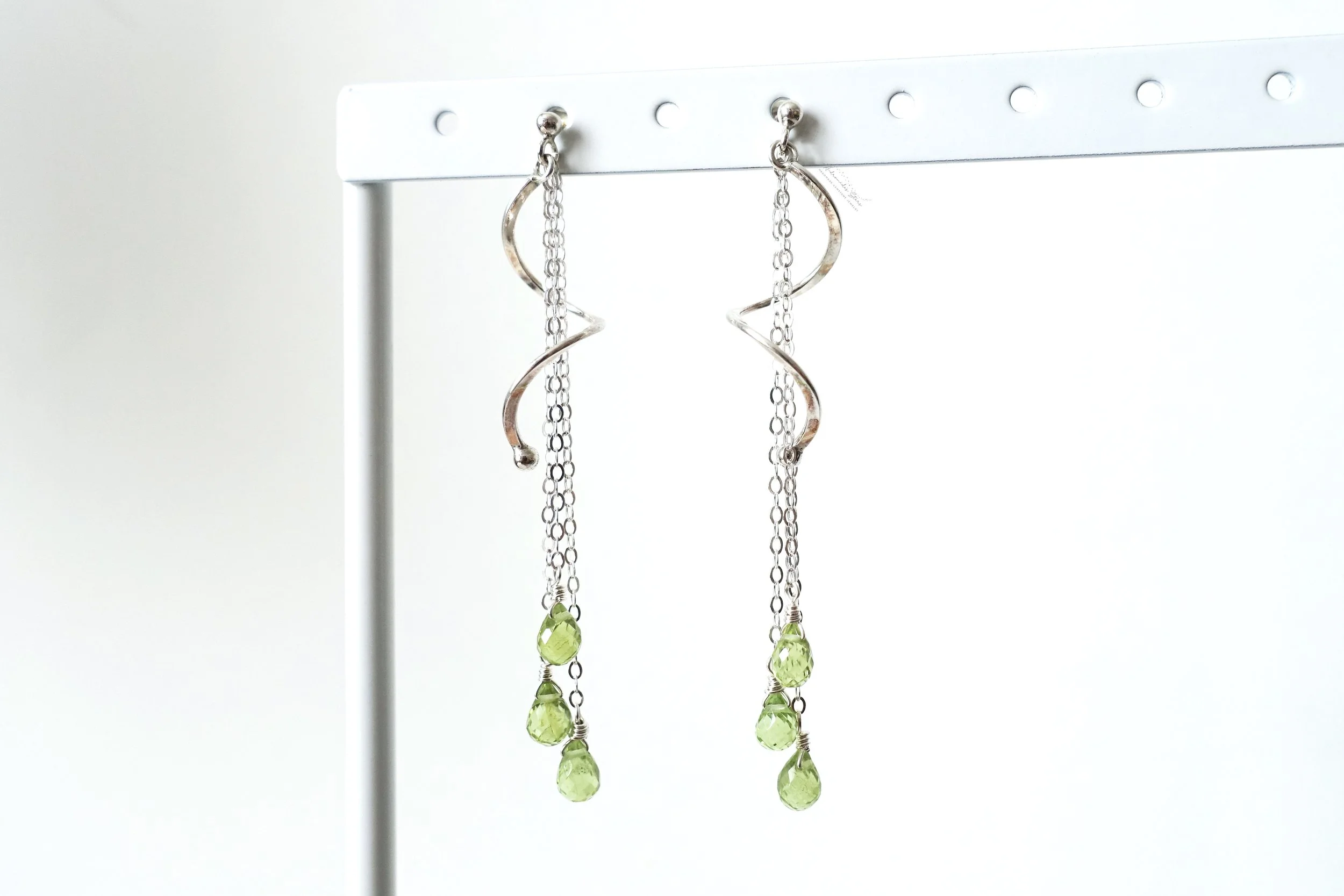 peridot spiral ss dangle earrings hanging.jpg