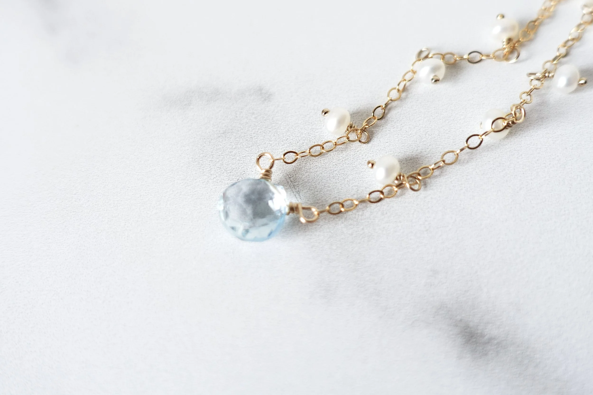 blue topaz pendant pearl gf necklace close up.jpg
