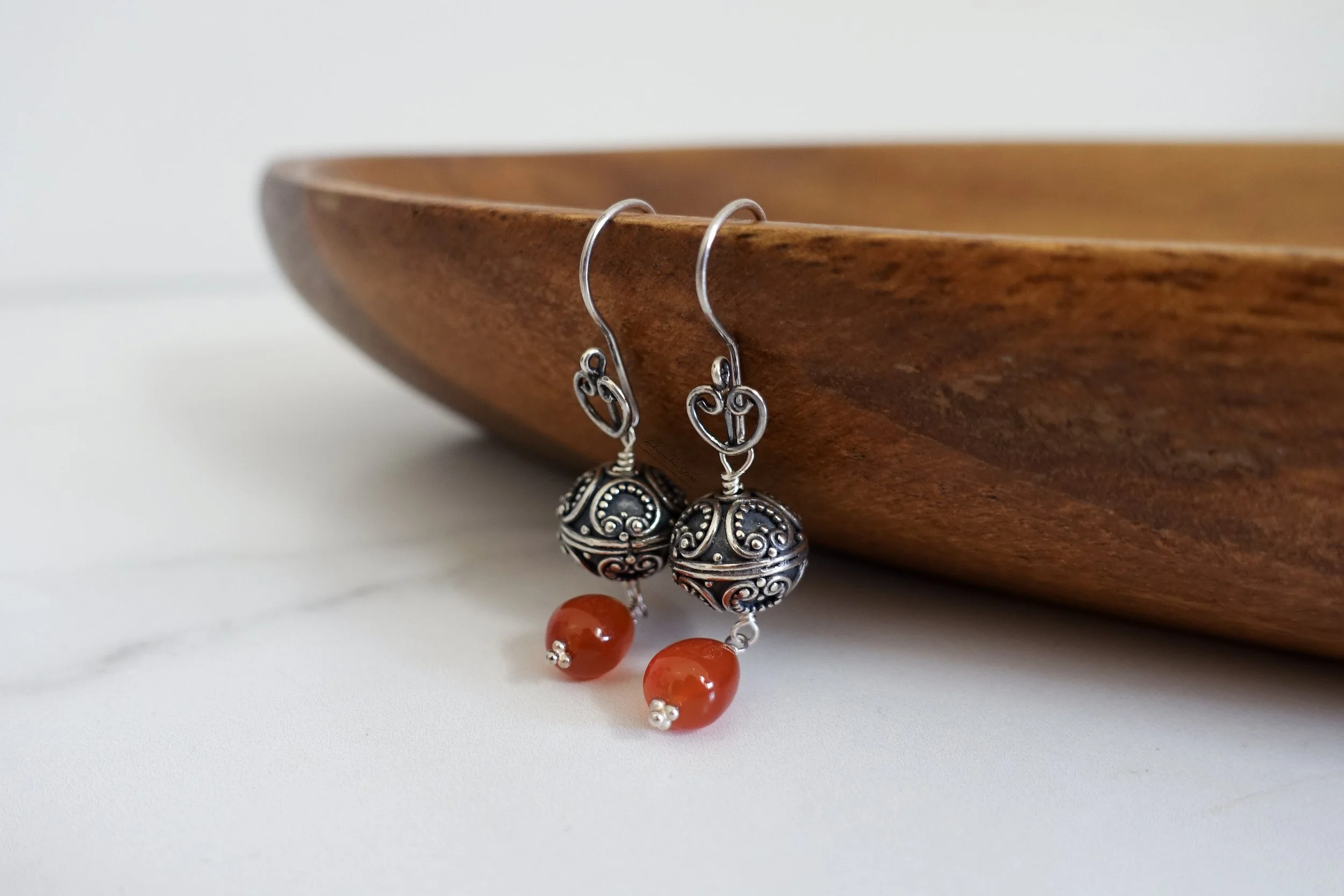 Bali silver carnelian earrings wooden tray.jpg