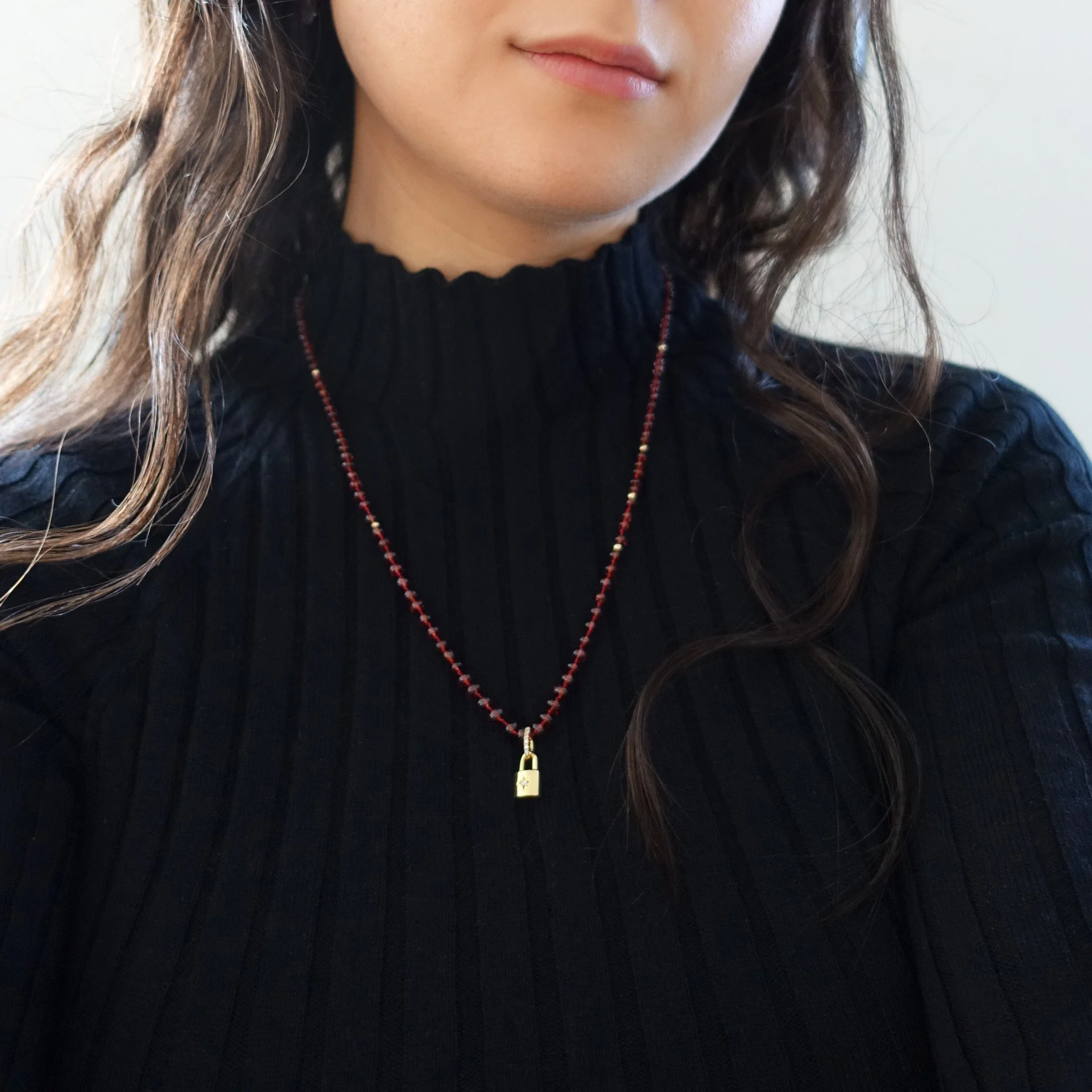 garnet padlock necklace on.jpg