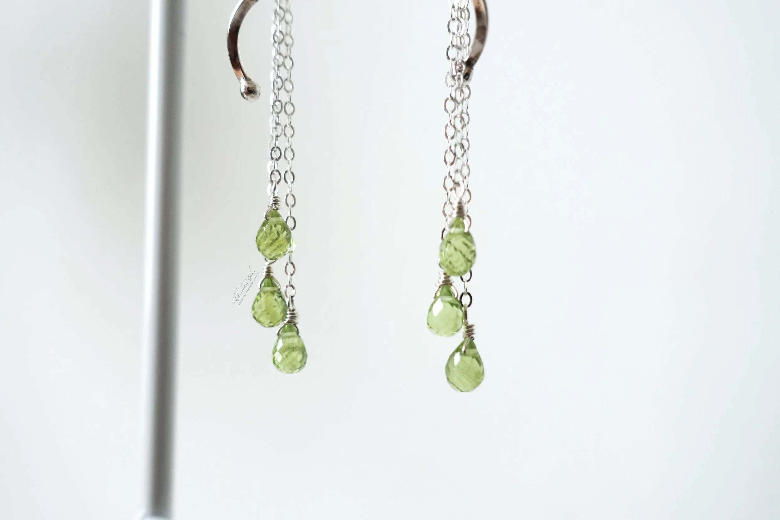 peridot spiral ss earrings close up of gems.jpg