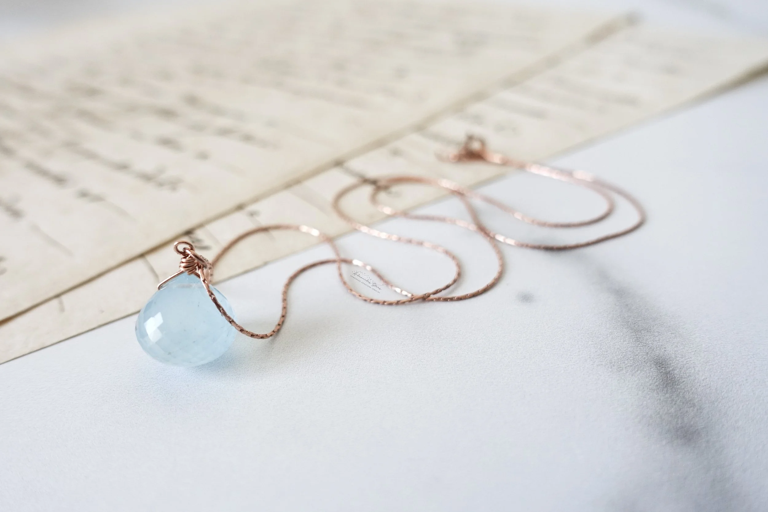 aquamarine rose gold necklace script.jpg