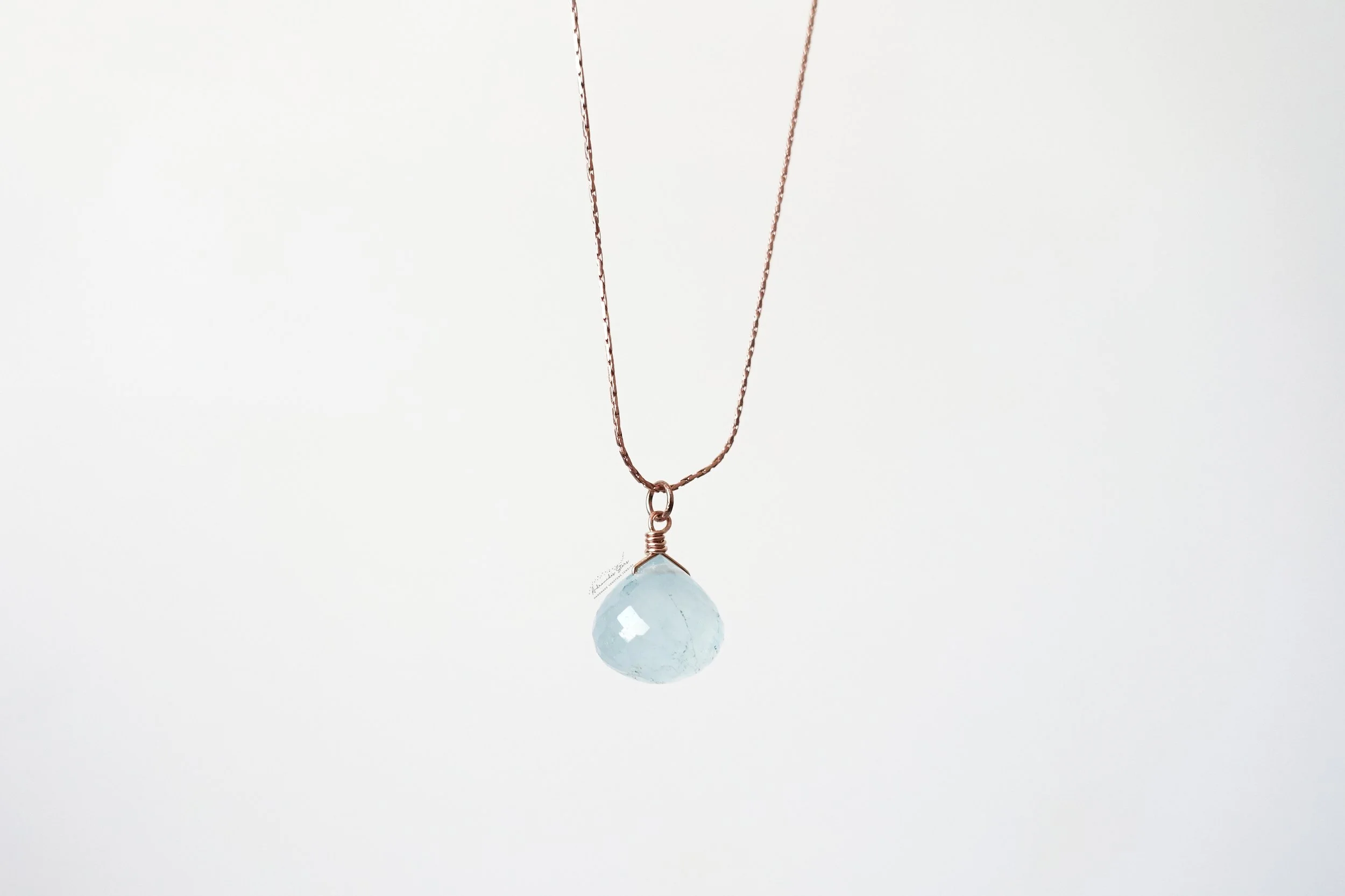 aquamarine rose gold necklace hanging .jpg