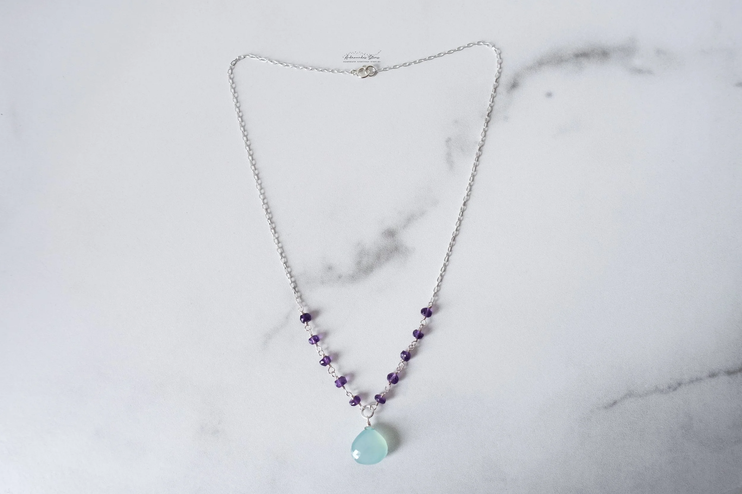 aqua chalcedony amethyst necklace full birds eye view.jpg