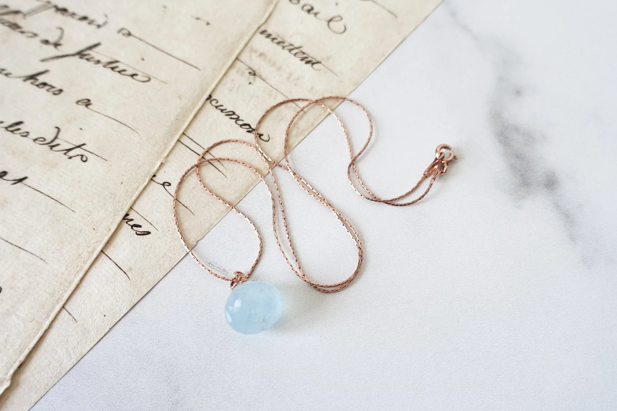 aquamarine rose gold necklace script side view.jpg