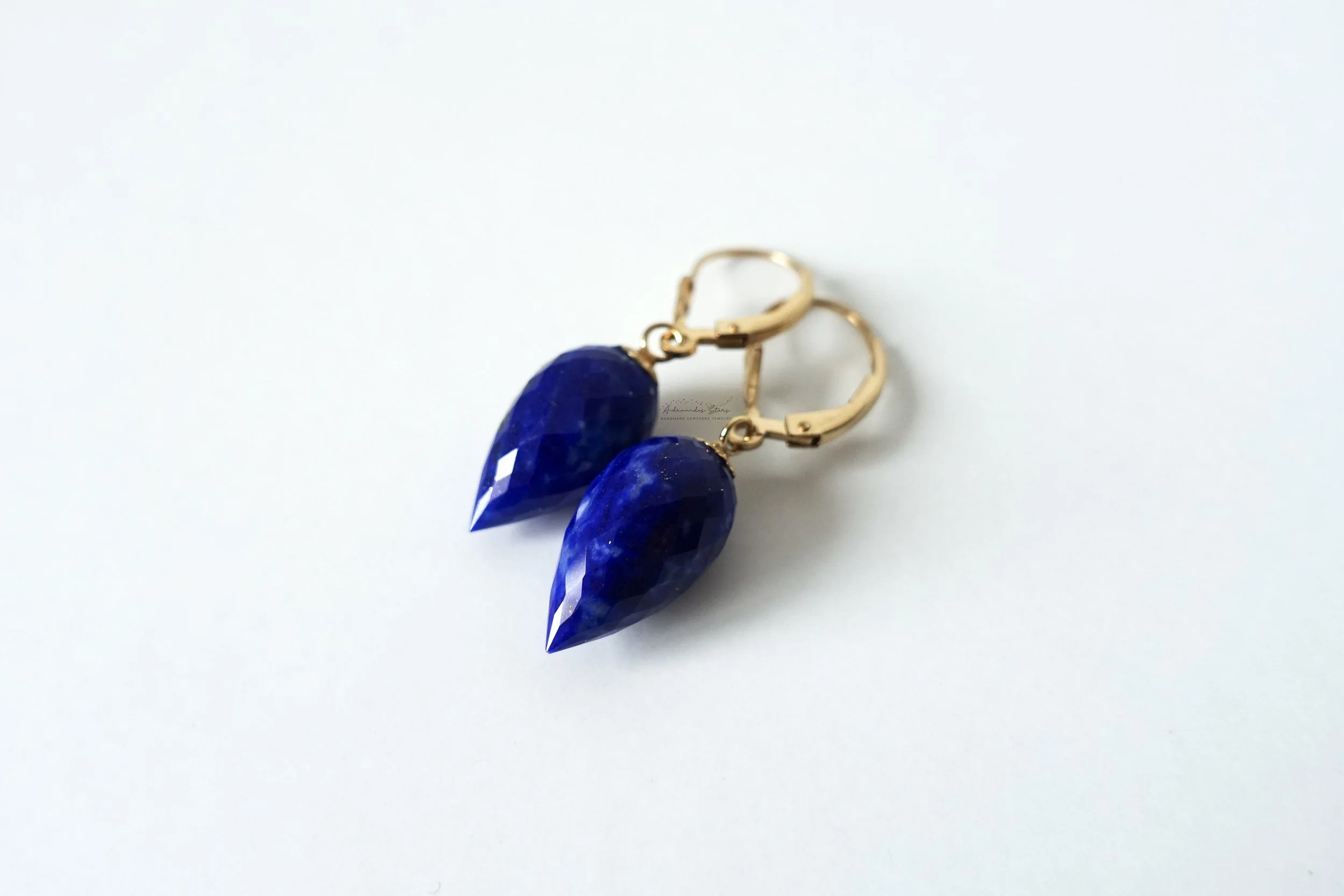 lapis lazuli earrings wite background diagonal.jpg
