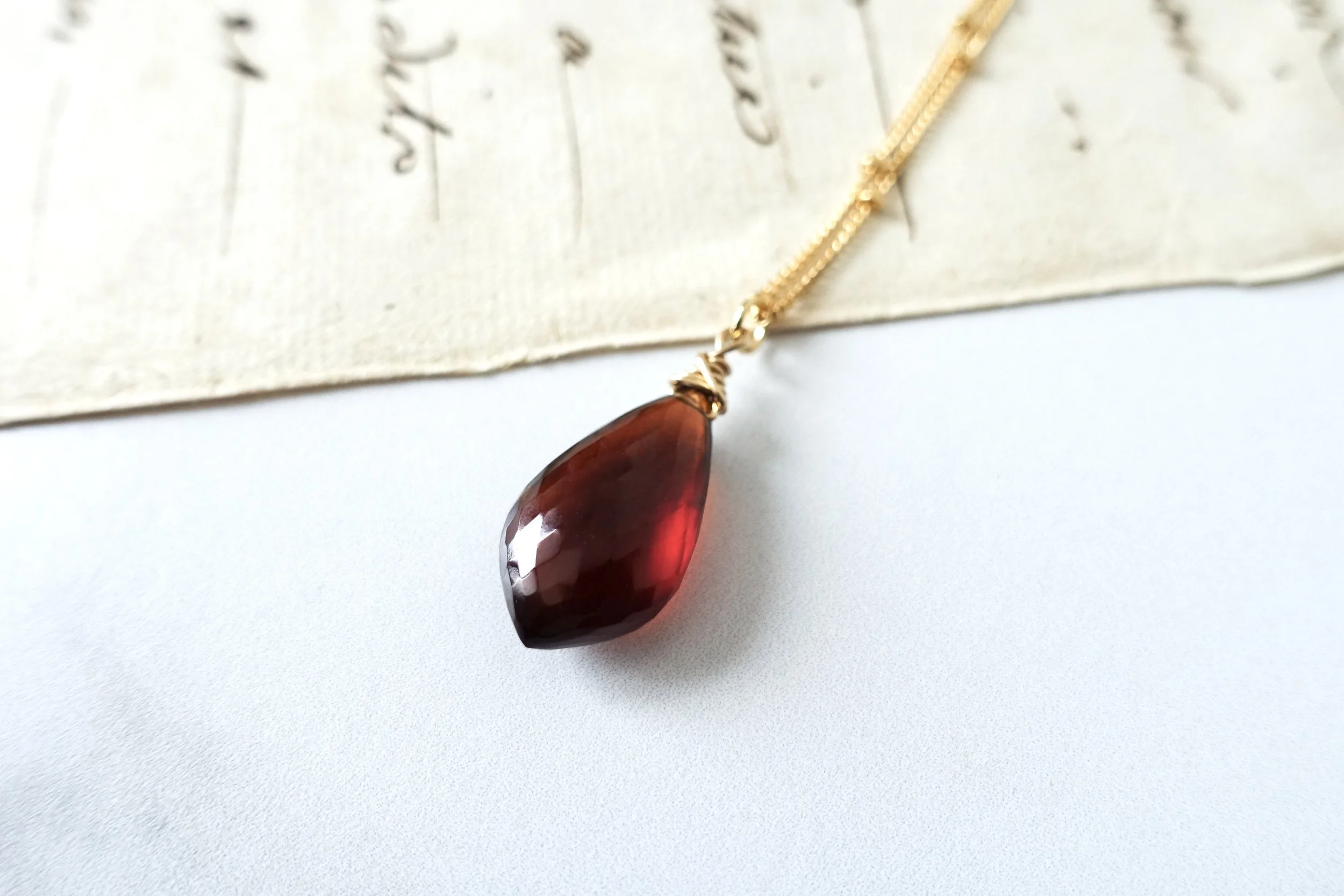garnet pendant satellite necklace script close up.jpg