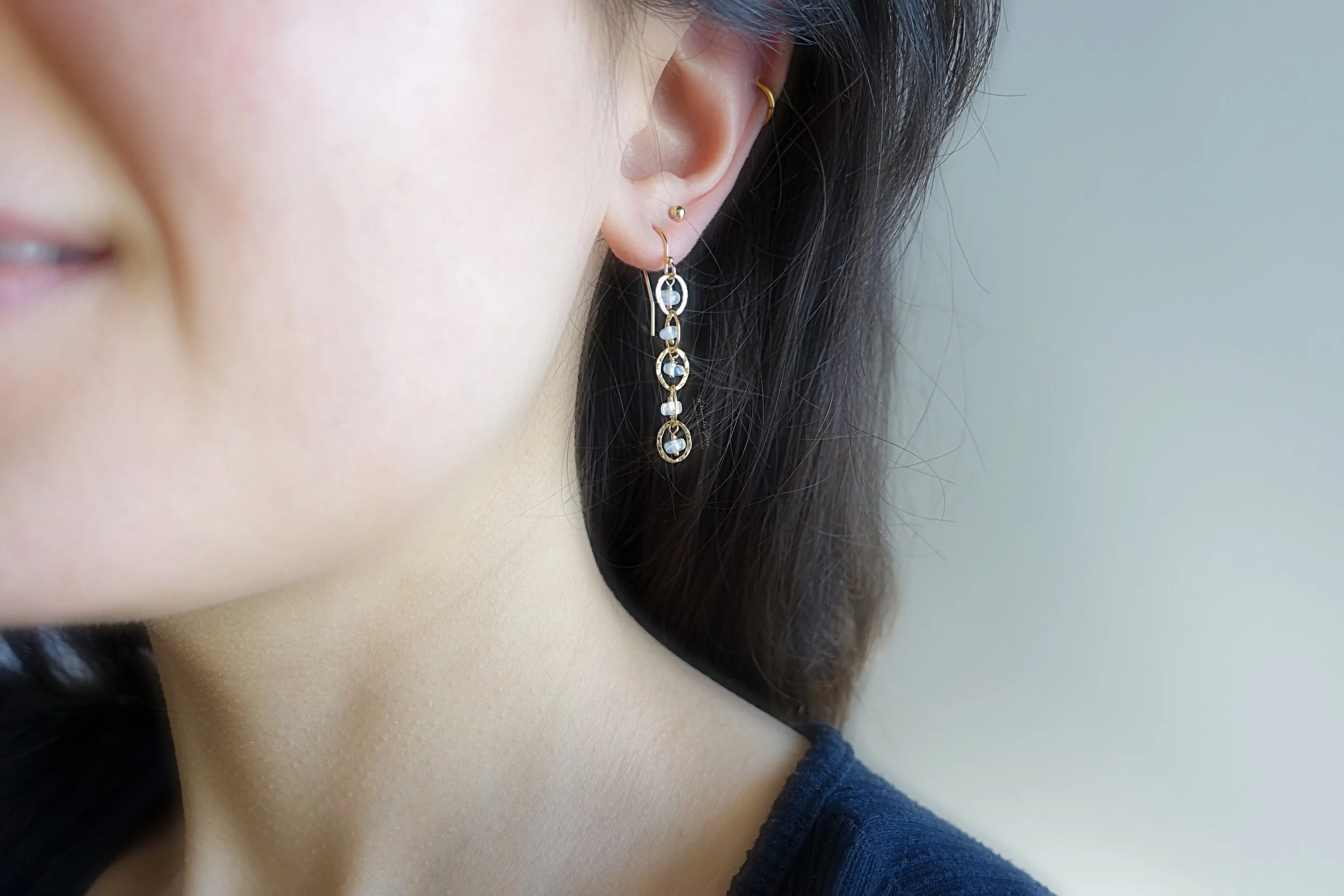moonstone gold earrings model.jpg