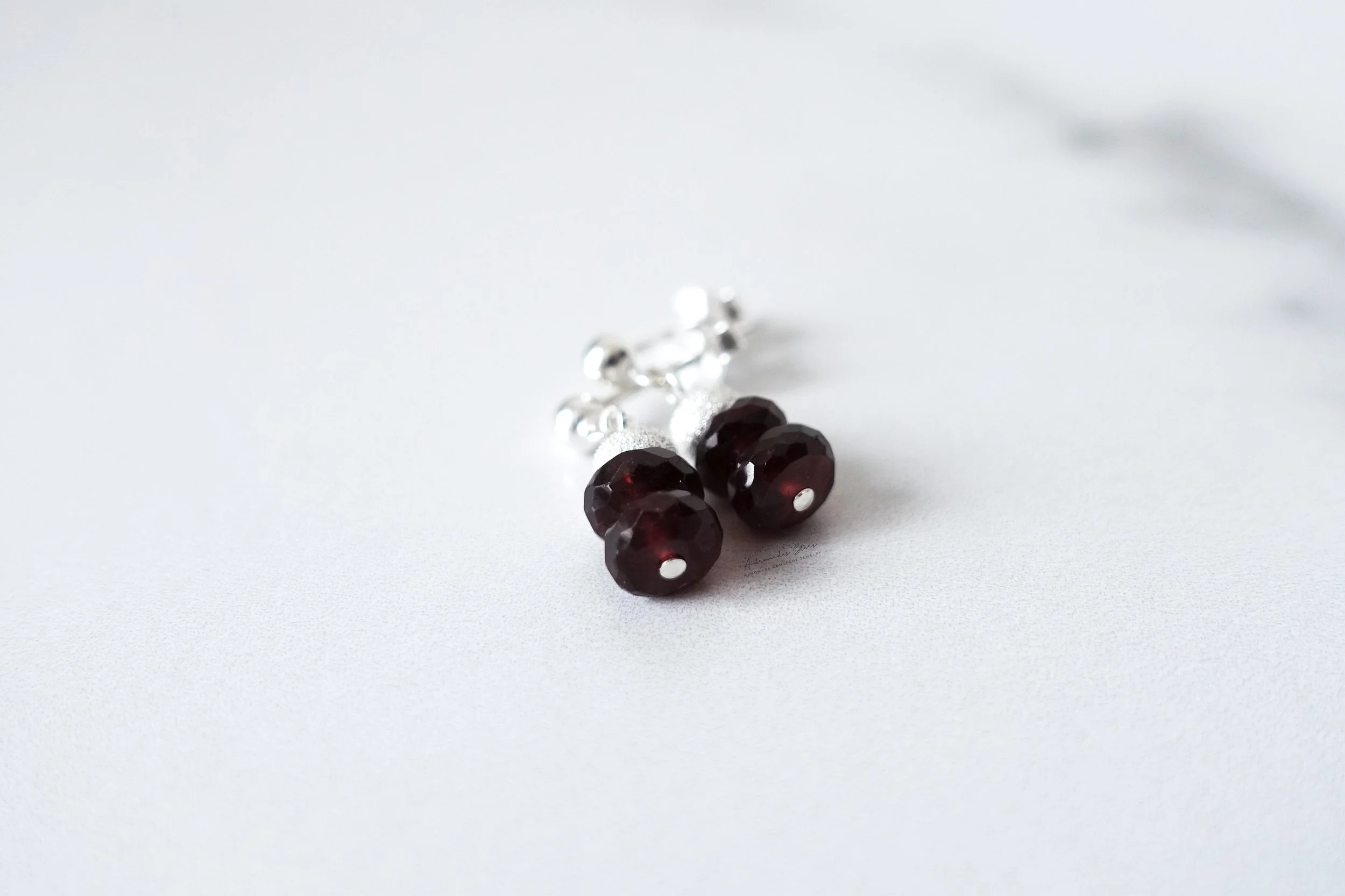garnet drop earrings close up.jpg