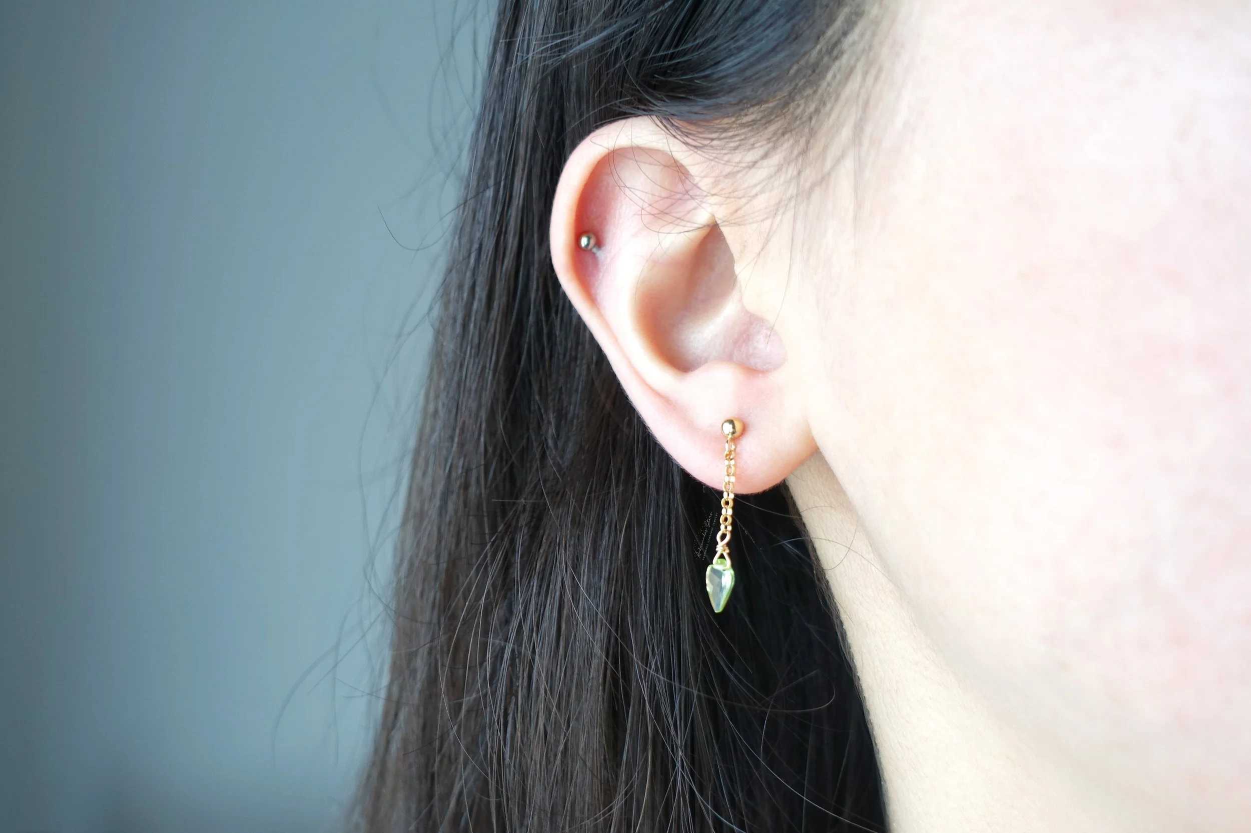 peridot arrowhead earrings model.jpg