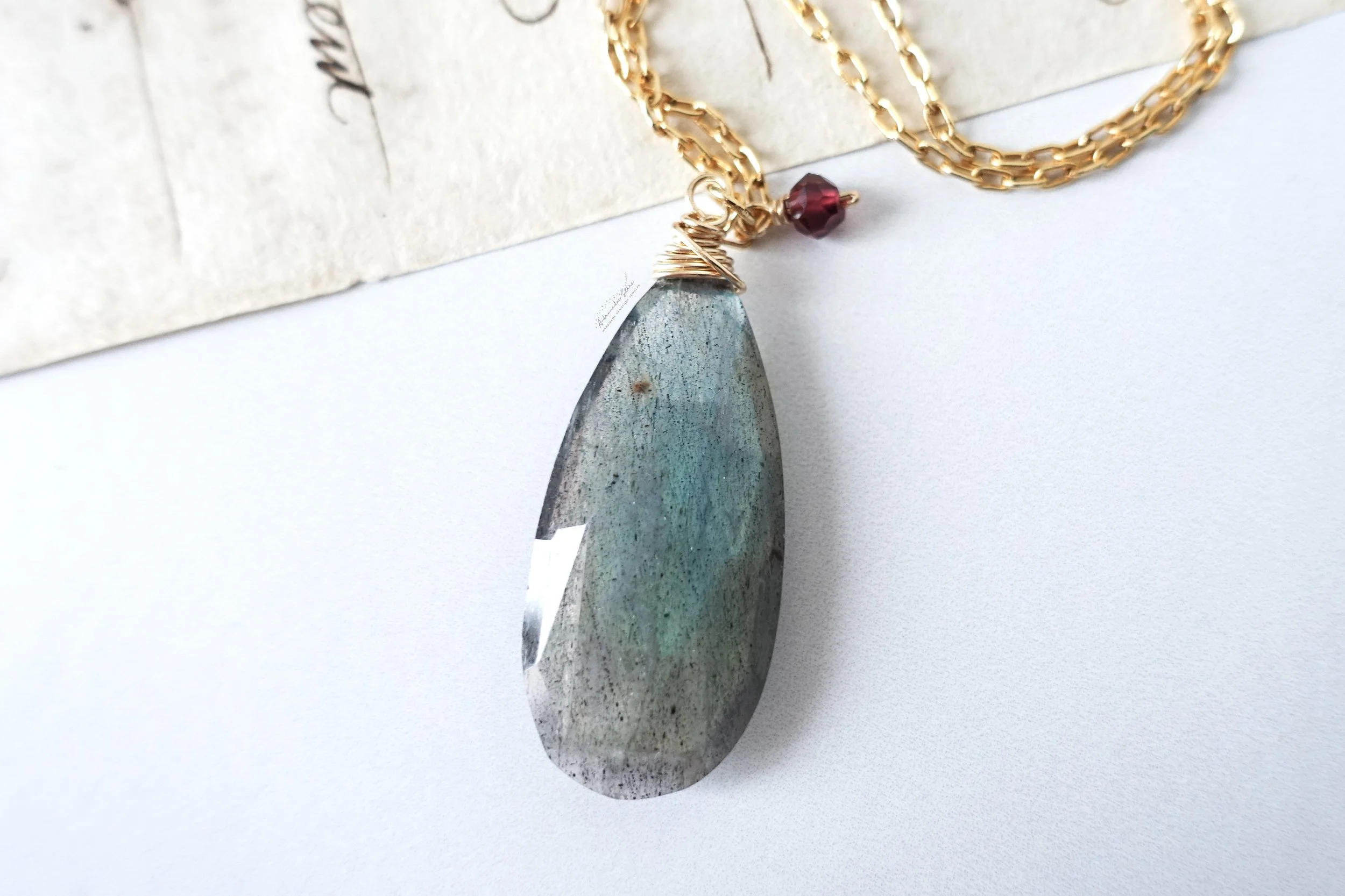 labradorite pendant garnet close up script.jpg