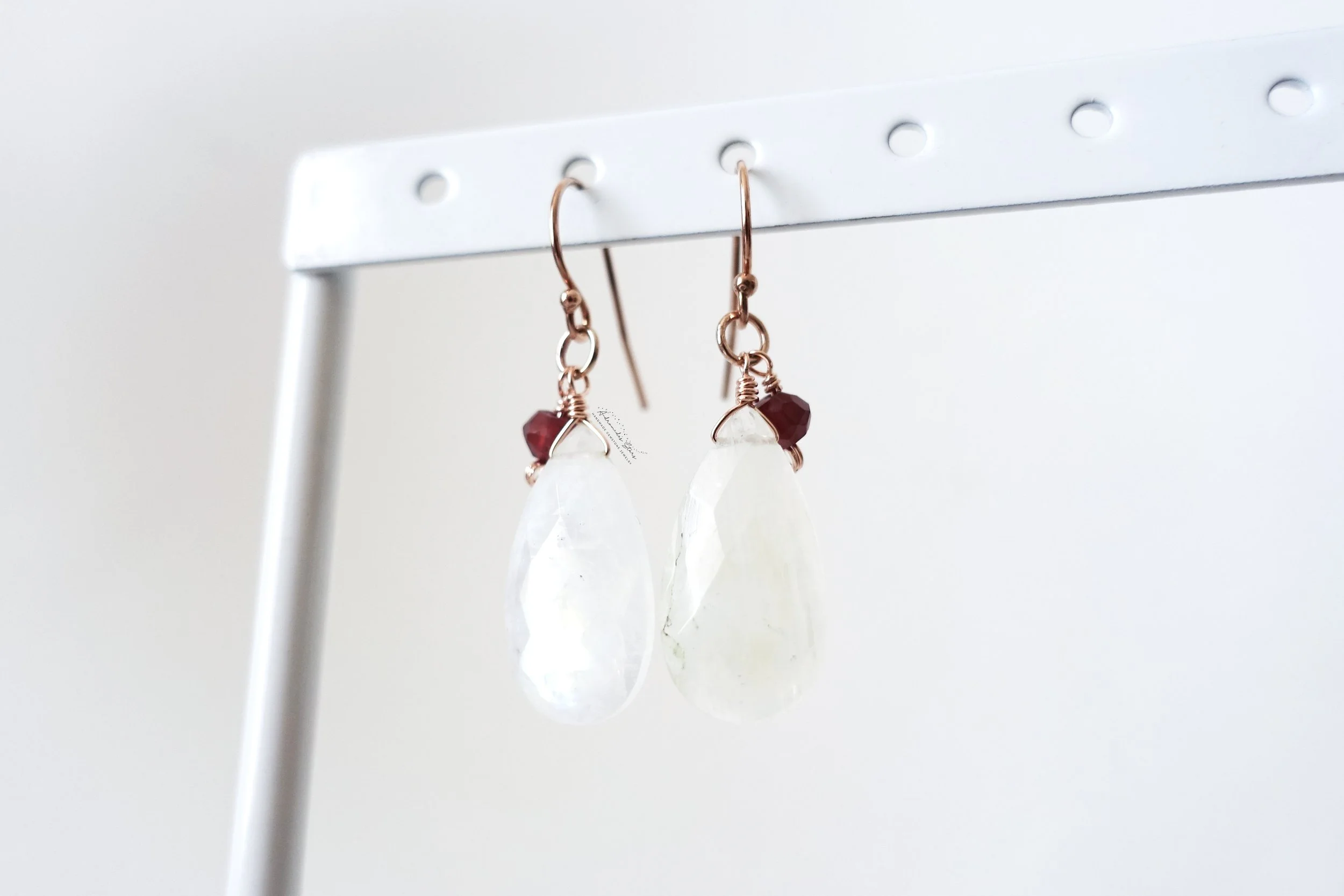 moonstone garnet rose gold earrings  hanging.jpg
