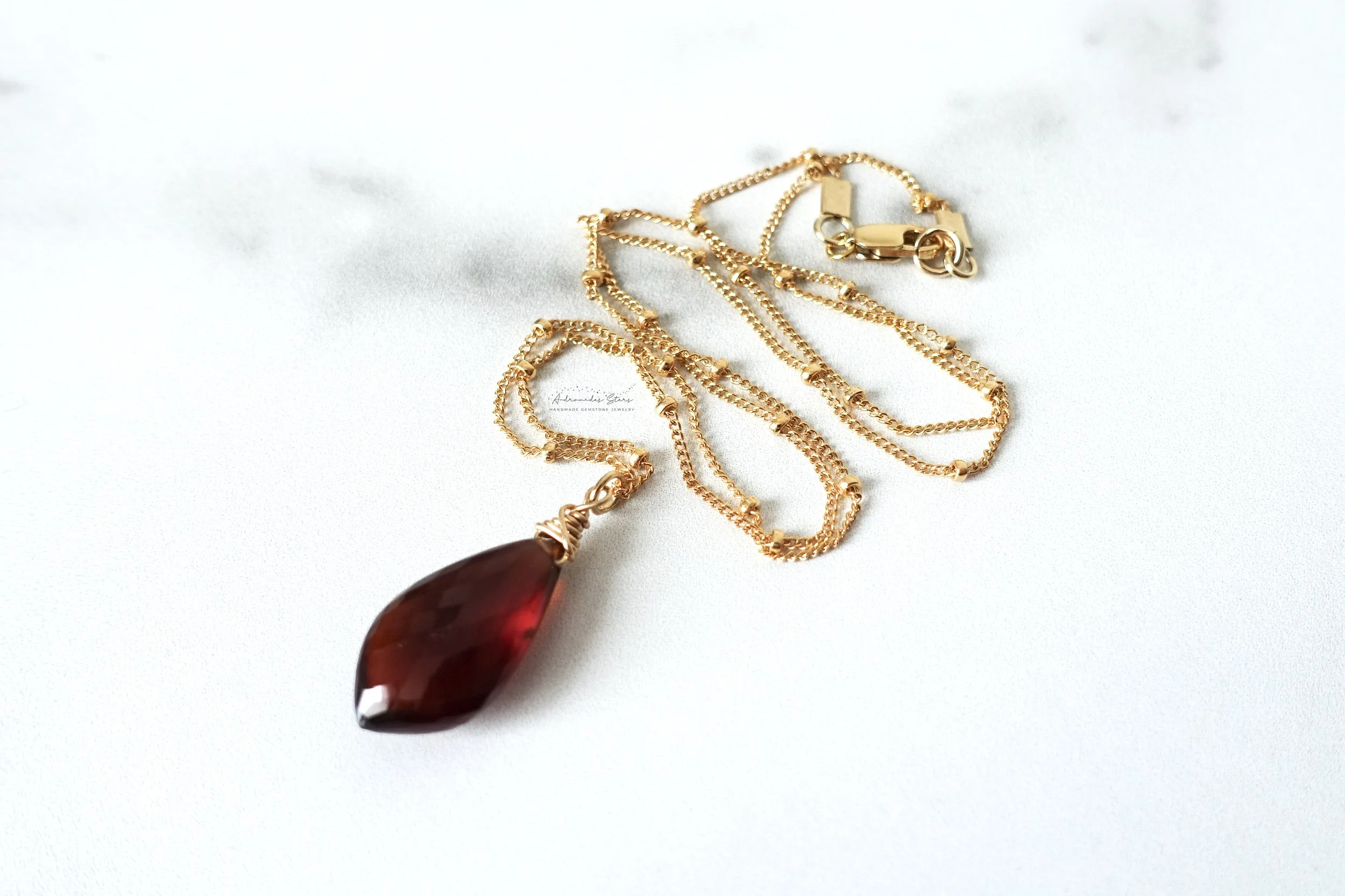 garnet satellite necklace squiggle close.jpg