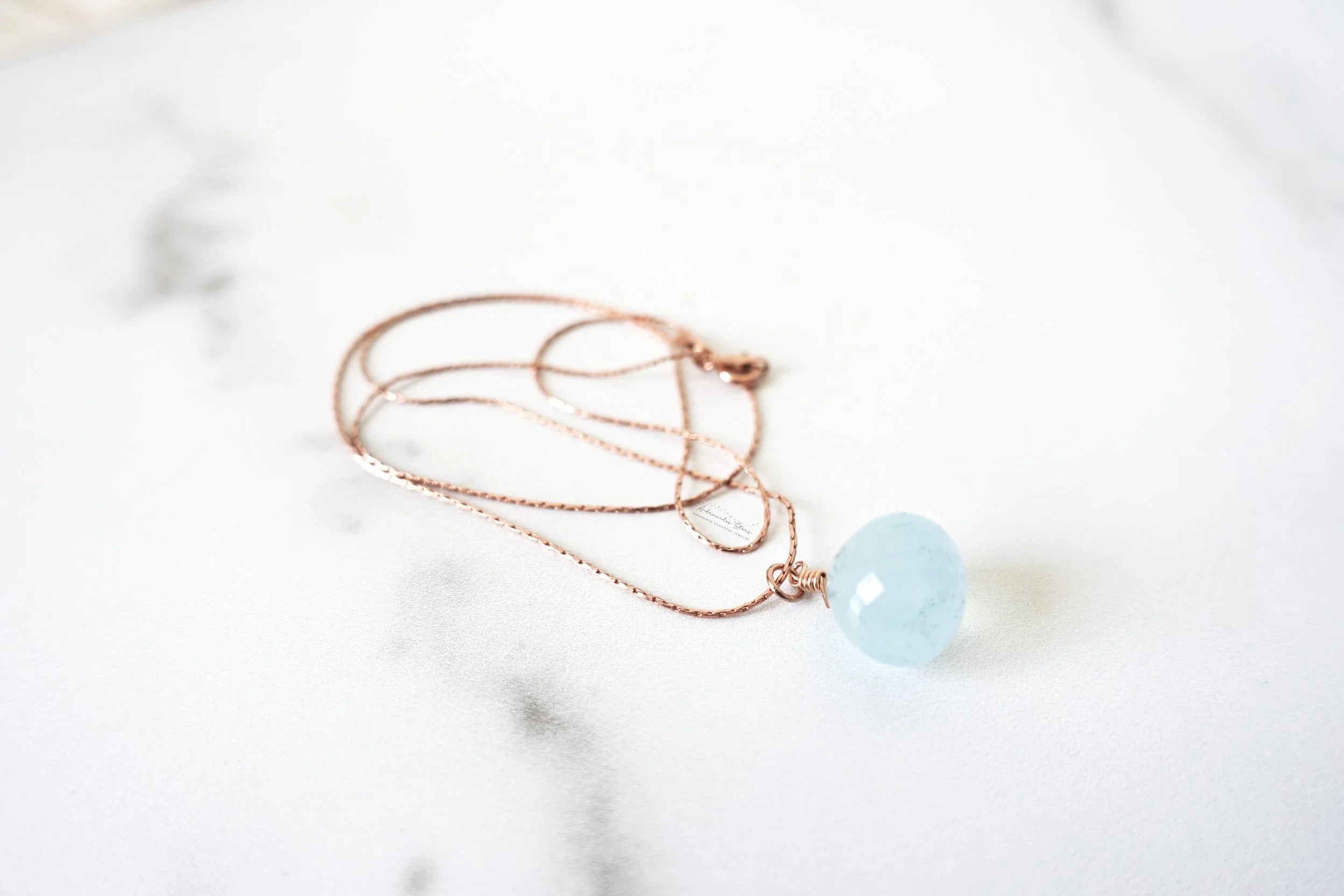 aquamarine rose gold necklace bottom of pendant side.jpg