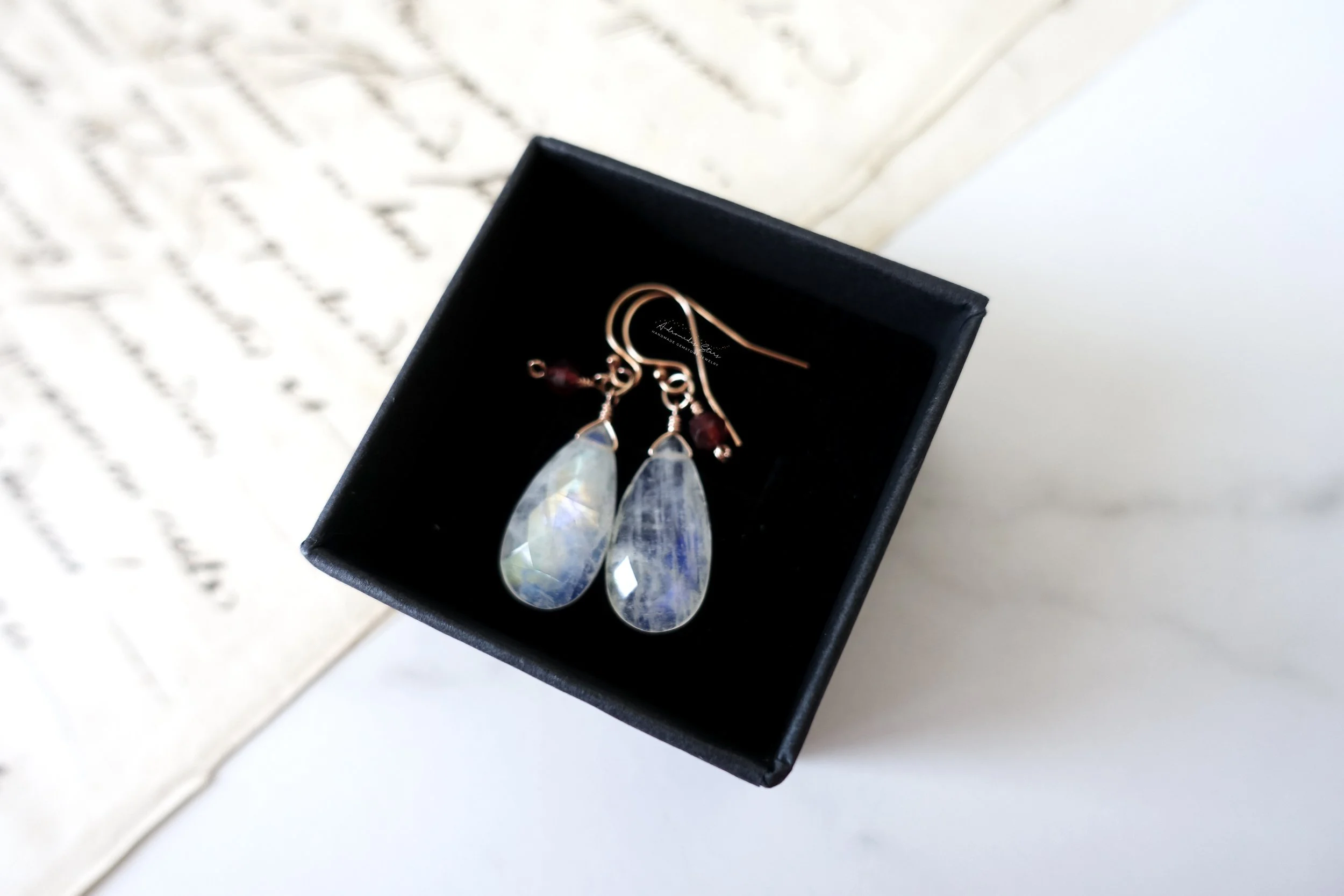moonstone garnet rose gold earrings black box.jpg