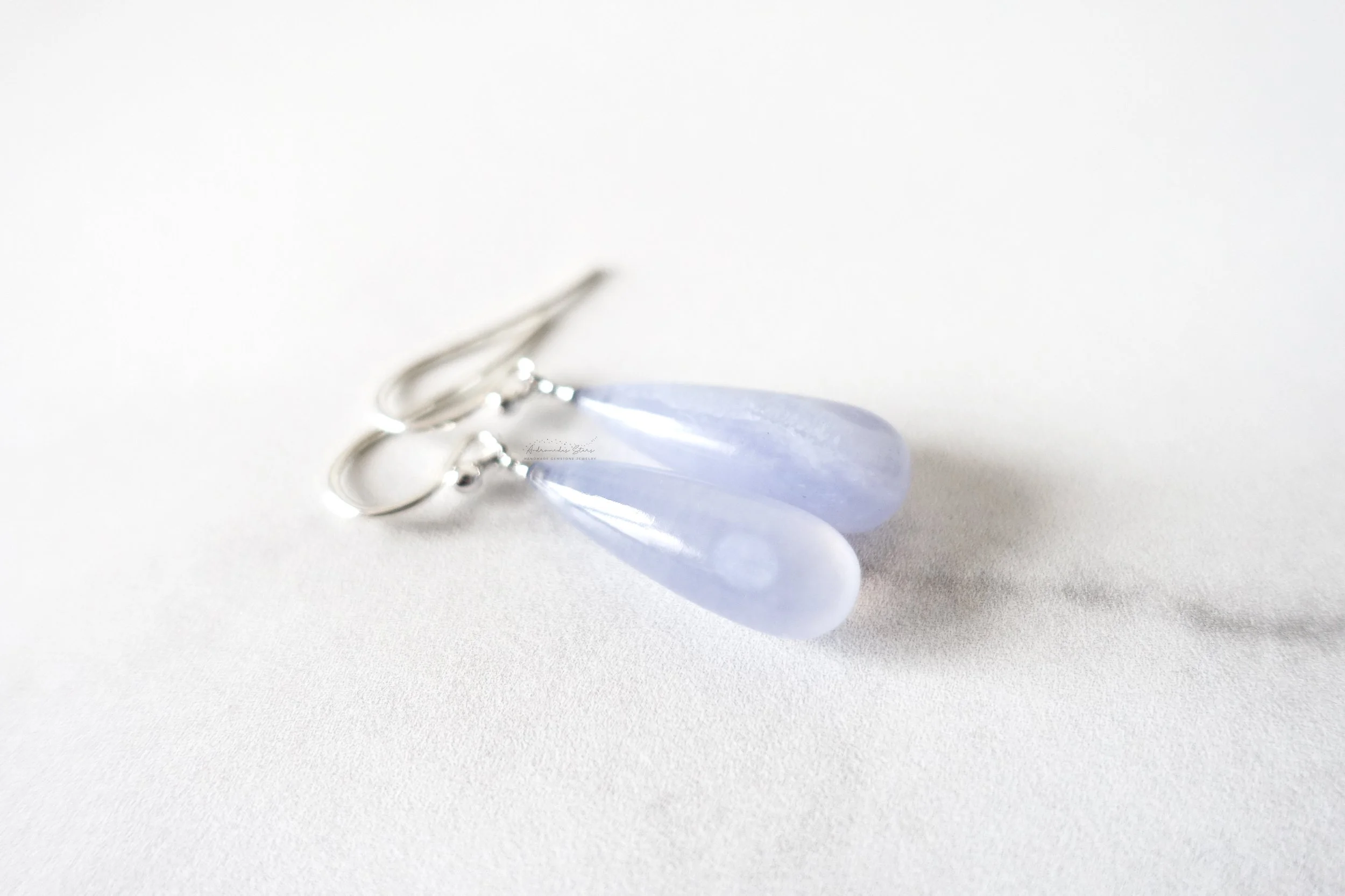 chalcedony drop earrings close up.jpg