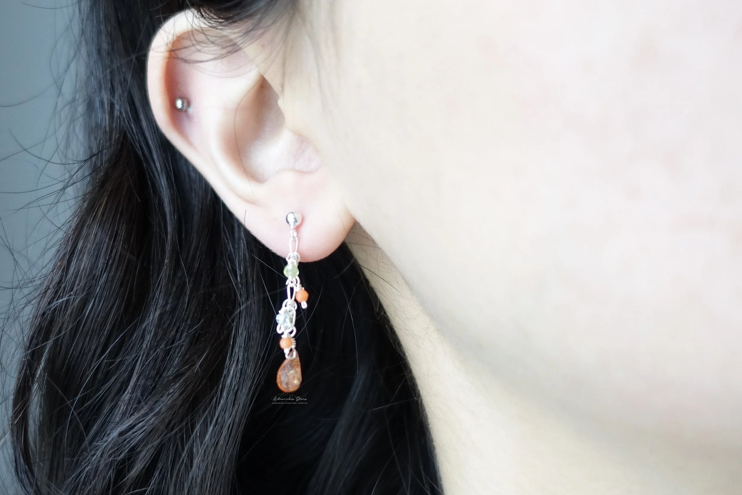 sunstone dangle earrings ear.jpg