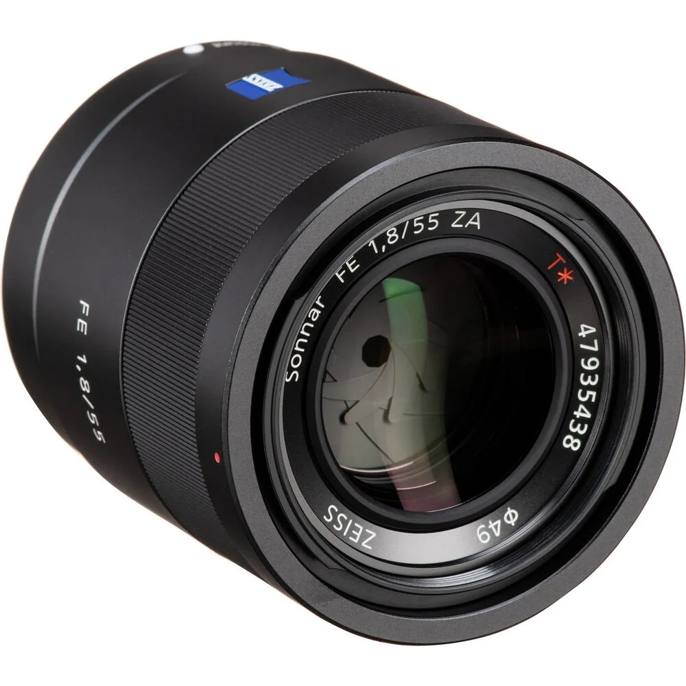 Close-up of the Sony FE 55mm F1.8 ZA Lens, showing front element and markings.