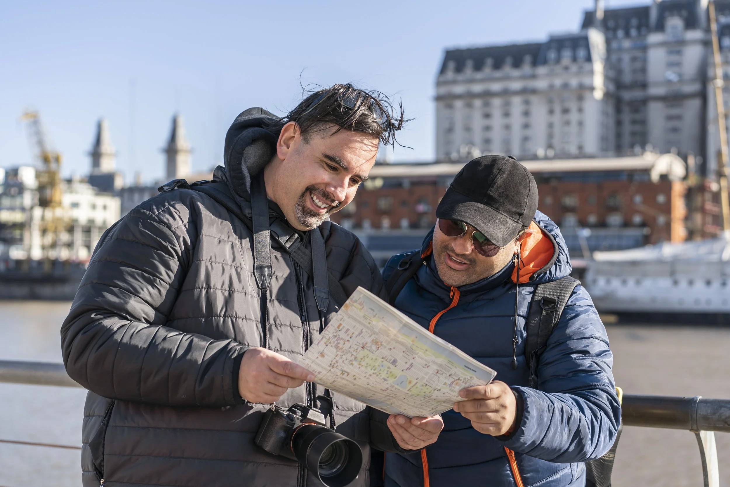 travelers-reading-a-map-lgbt-couple-travel-frie-2025-03-11-18-53-30-utc.jpg