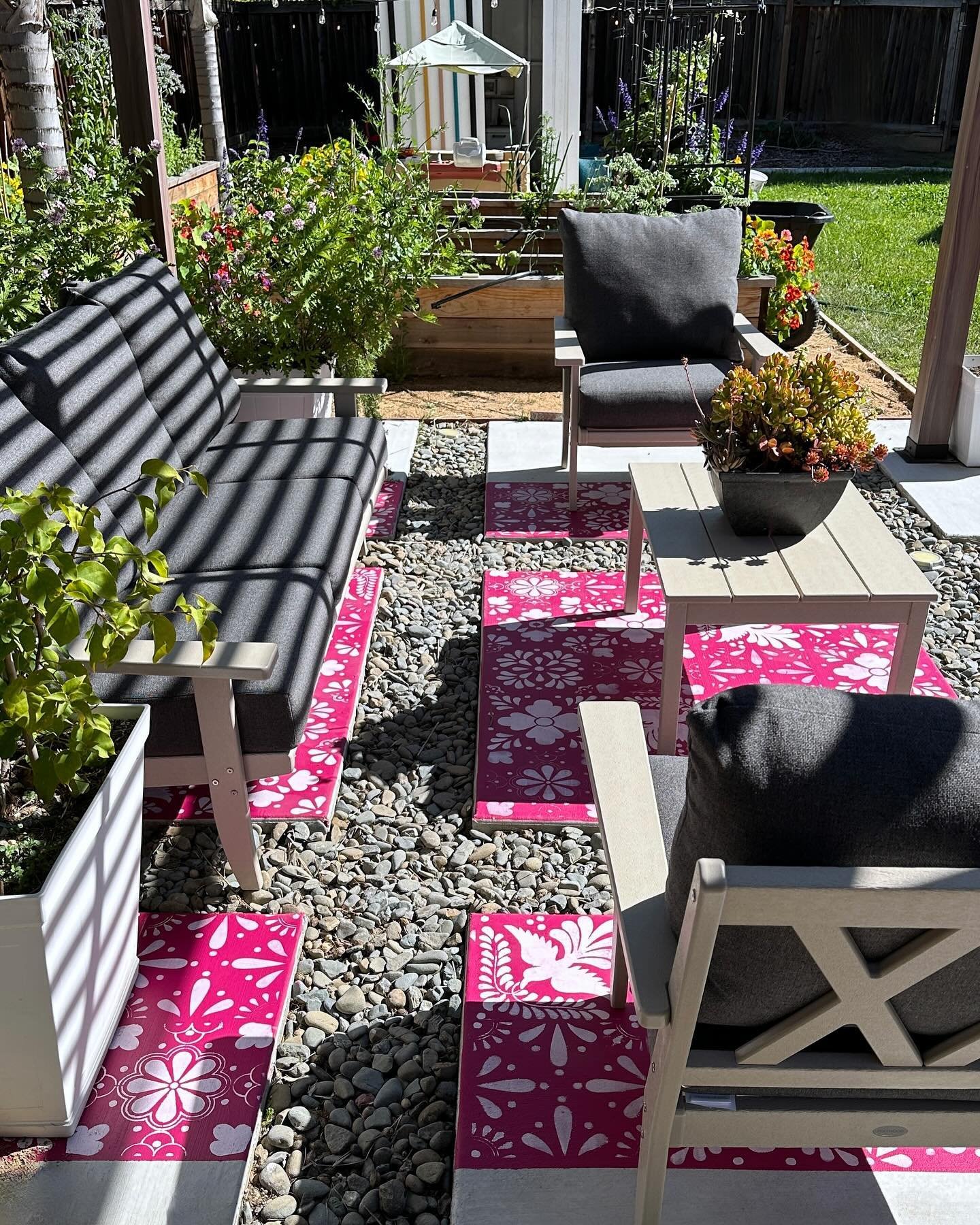 Outdoor painted faux rug in a photo carousel for you to use as inspo 😉. 

Inspired by the magenta bougainvillea I've been planting all around our house plus Otomi art, this project was under $100 and makes a huge impact on this outdoor living space.