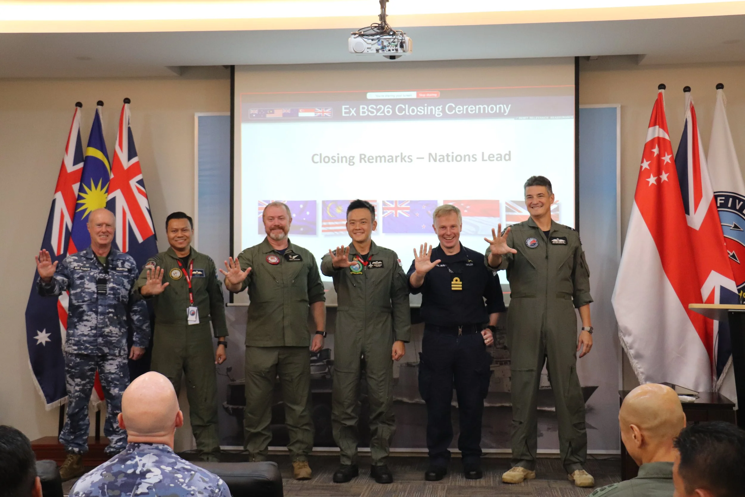 CIADS and national leads posing with a symbolic ‘5’ representing five nations